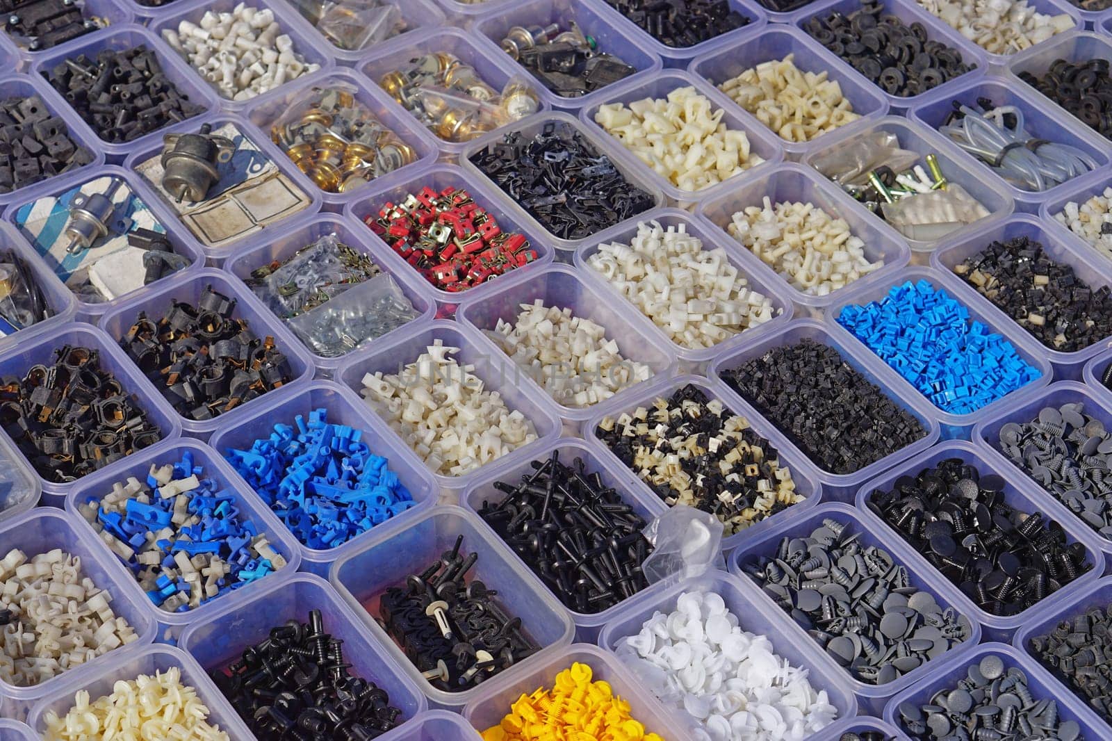 Small plastic car parts connectors in boxes