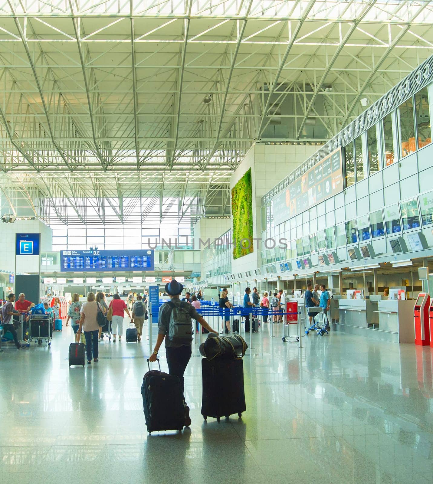 FRANKFURT, GERMANY - AUGUST 29, 2018: People at Frankfurt am Main airport hall. Frankfurt Airport is the busiest airport by passenger traffic in Germany as well as the 4th busiest in Europe
