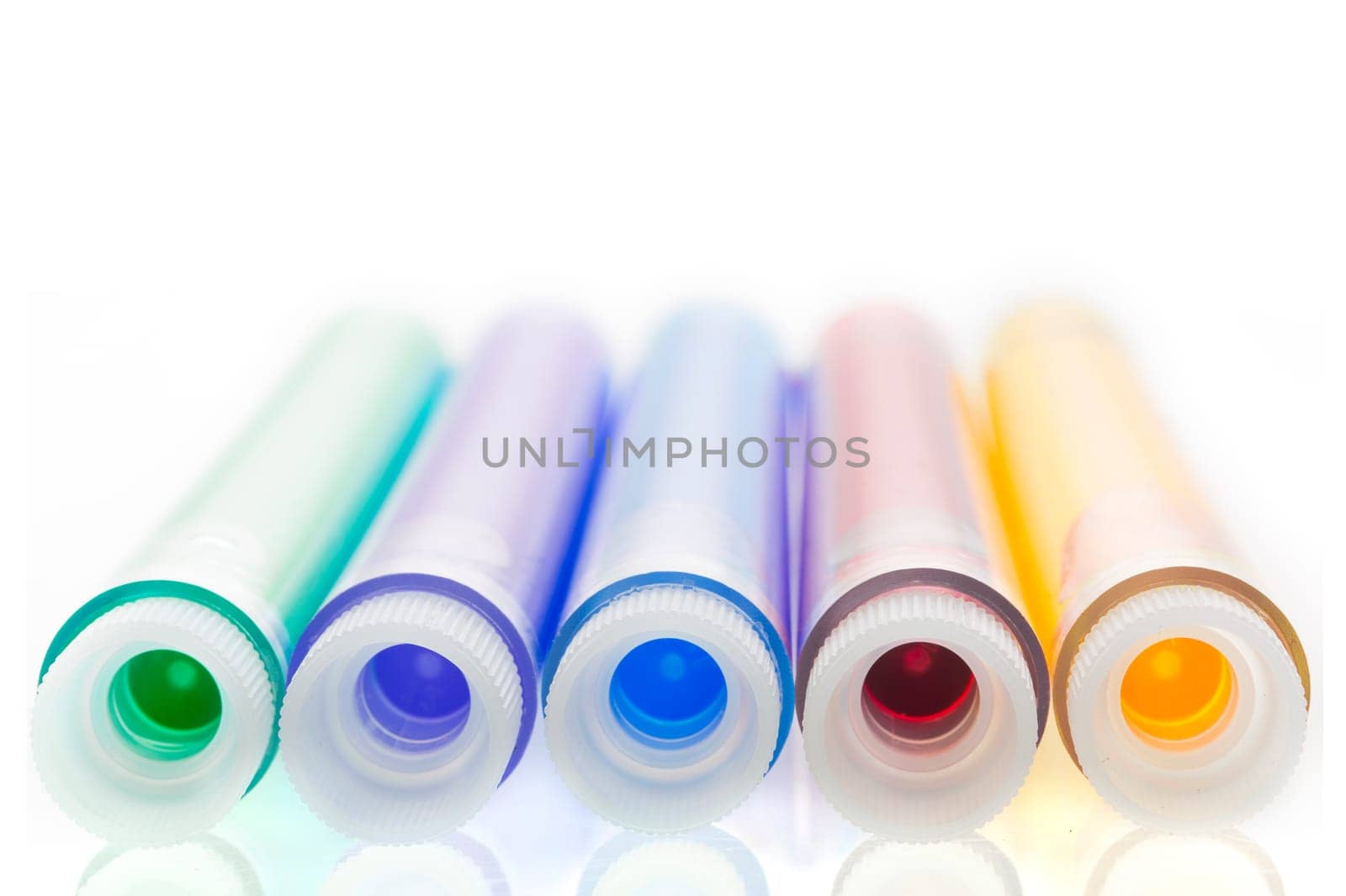 Colorful liquids, green, purple, blue, red and yellow, in test tubes with stoppers.