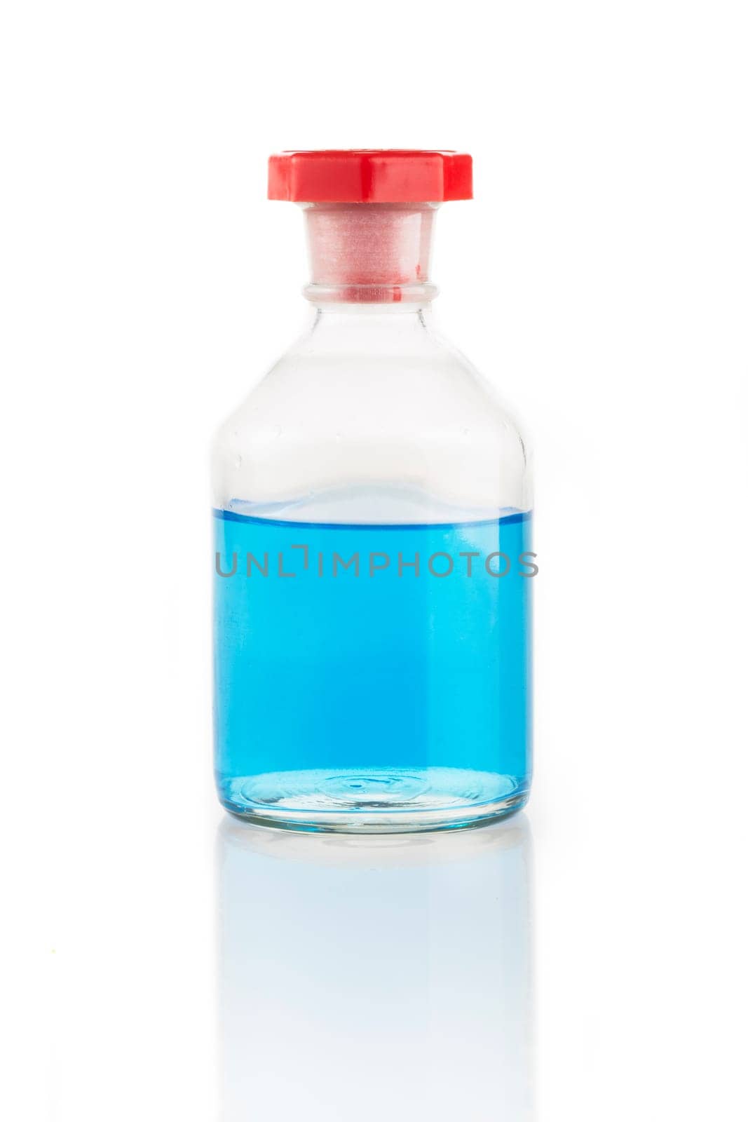 Clear glass bottle with blue liquid and red stopper.
