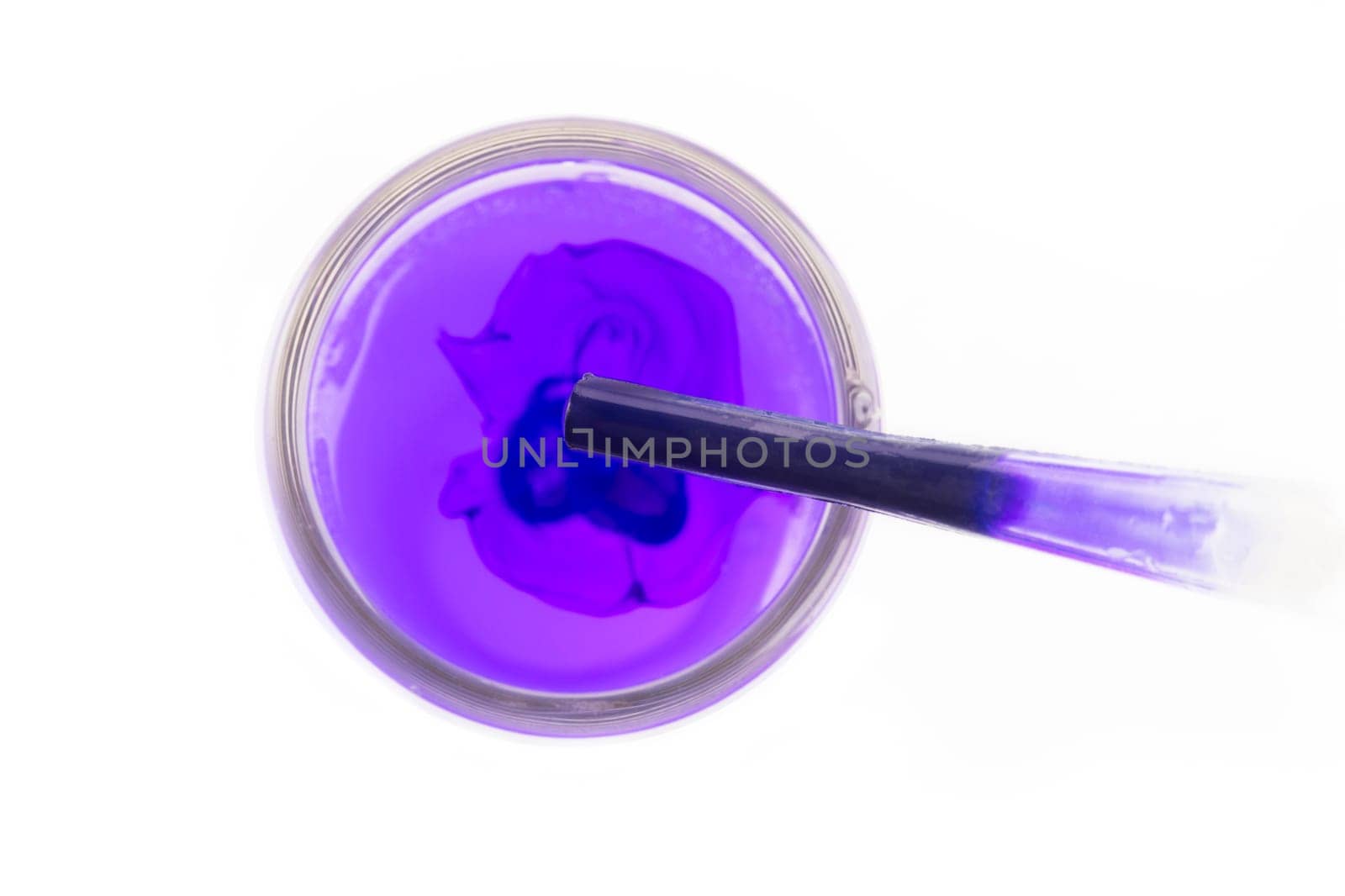 Purple fluid in pipette above test tube