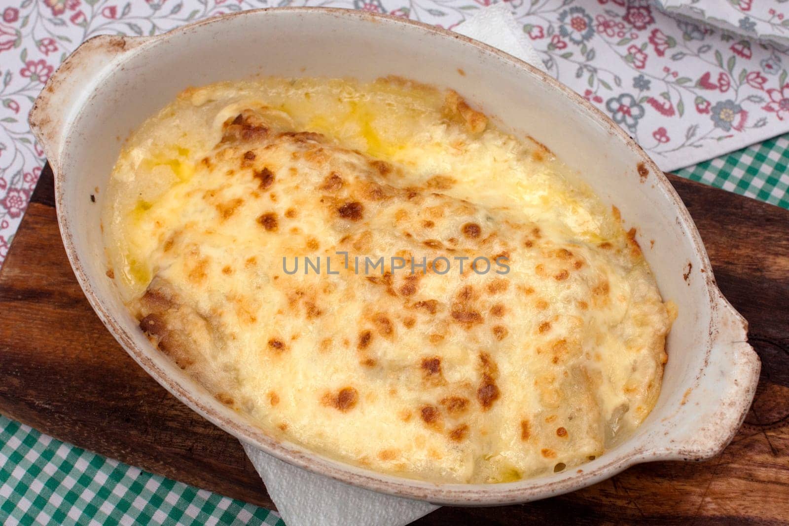 Lasagne Italian food is baked with a lot of cheese, rustic traditional food.