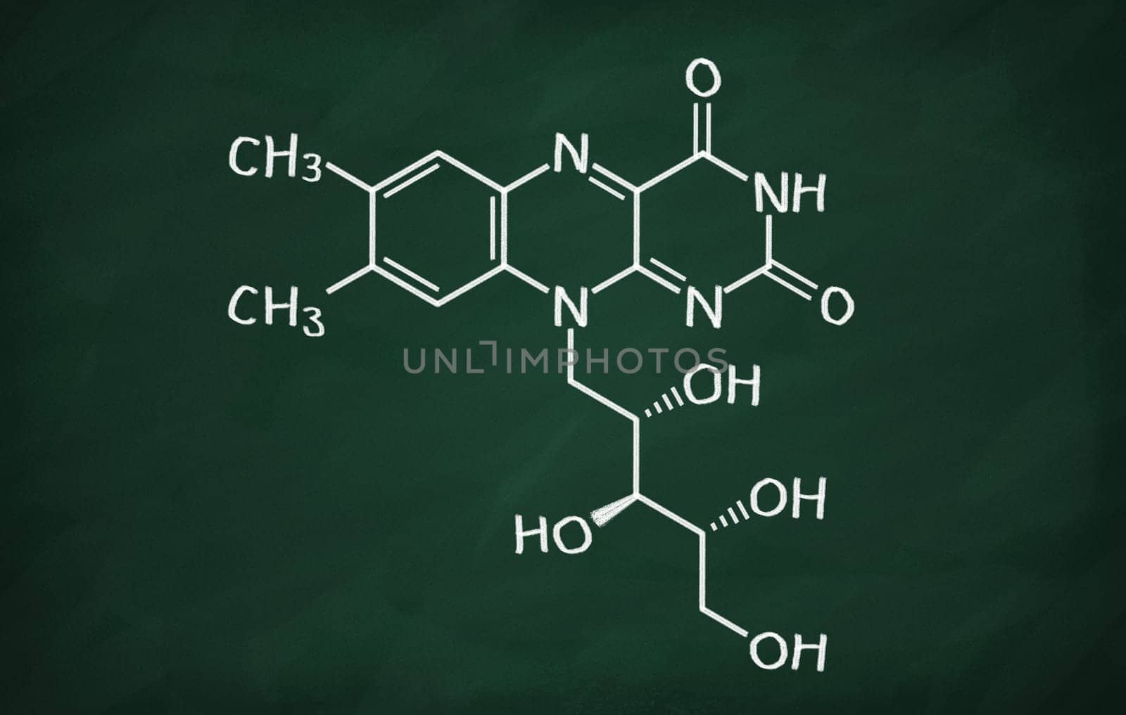 Structural model of Vitamin B2 (Riboflavin) on the blackboard.