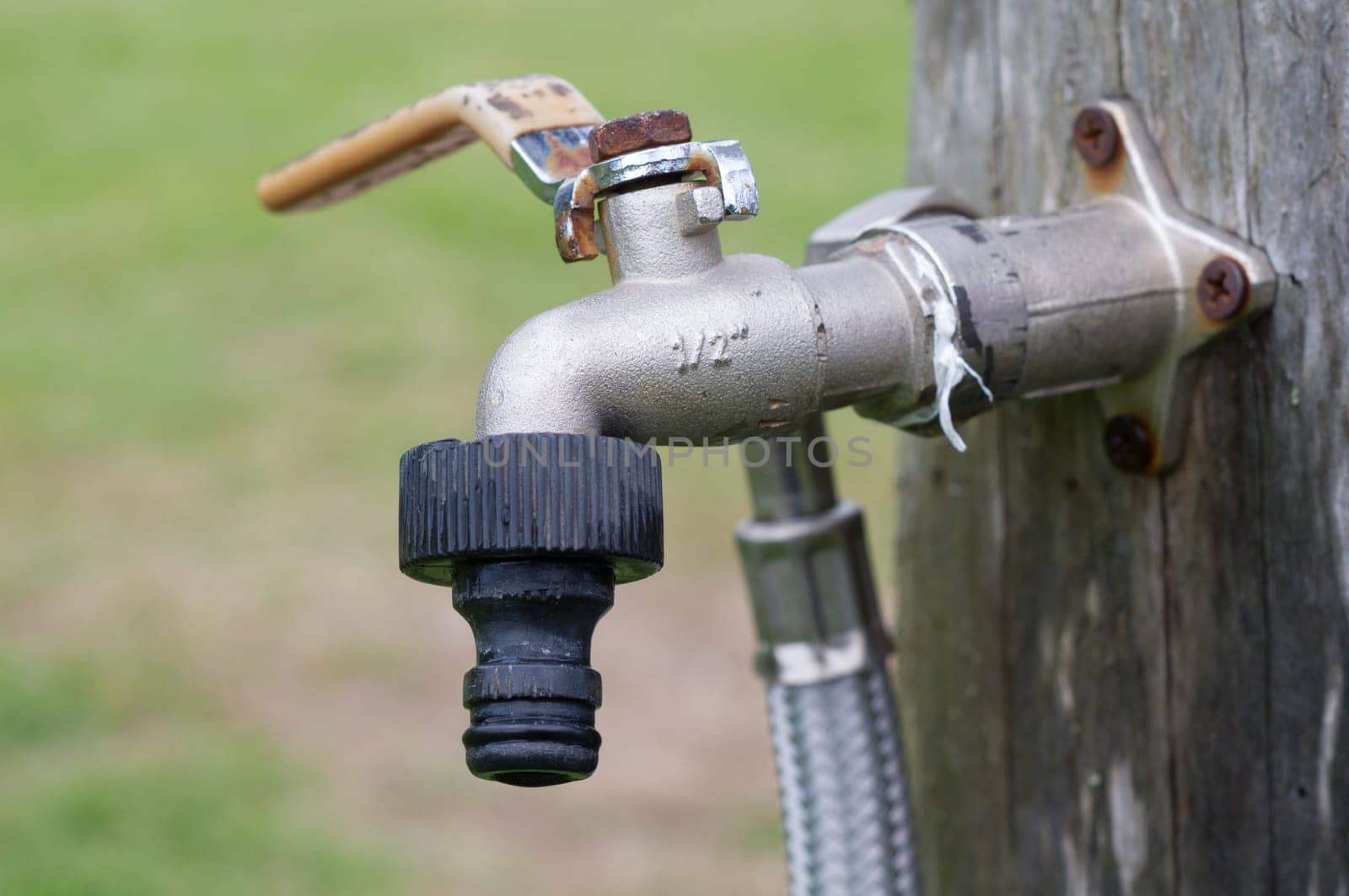 Old tap in the garden without water