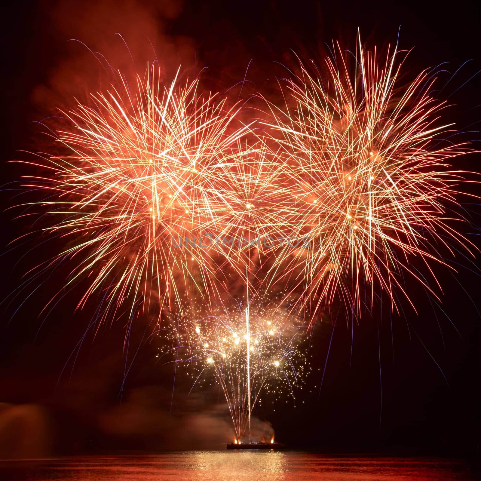 Colorful red fireworks on the black sky background