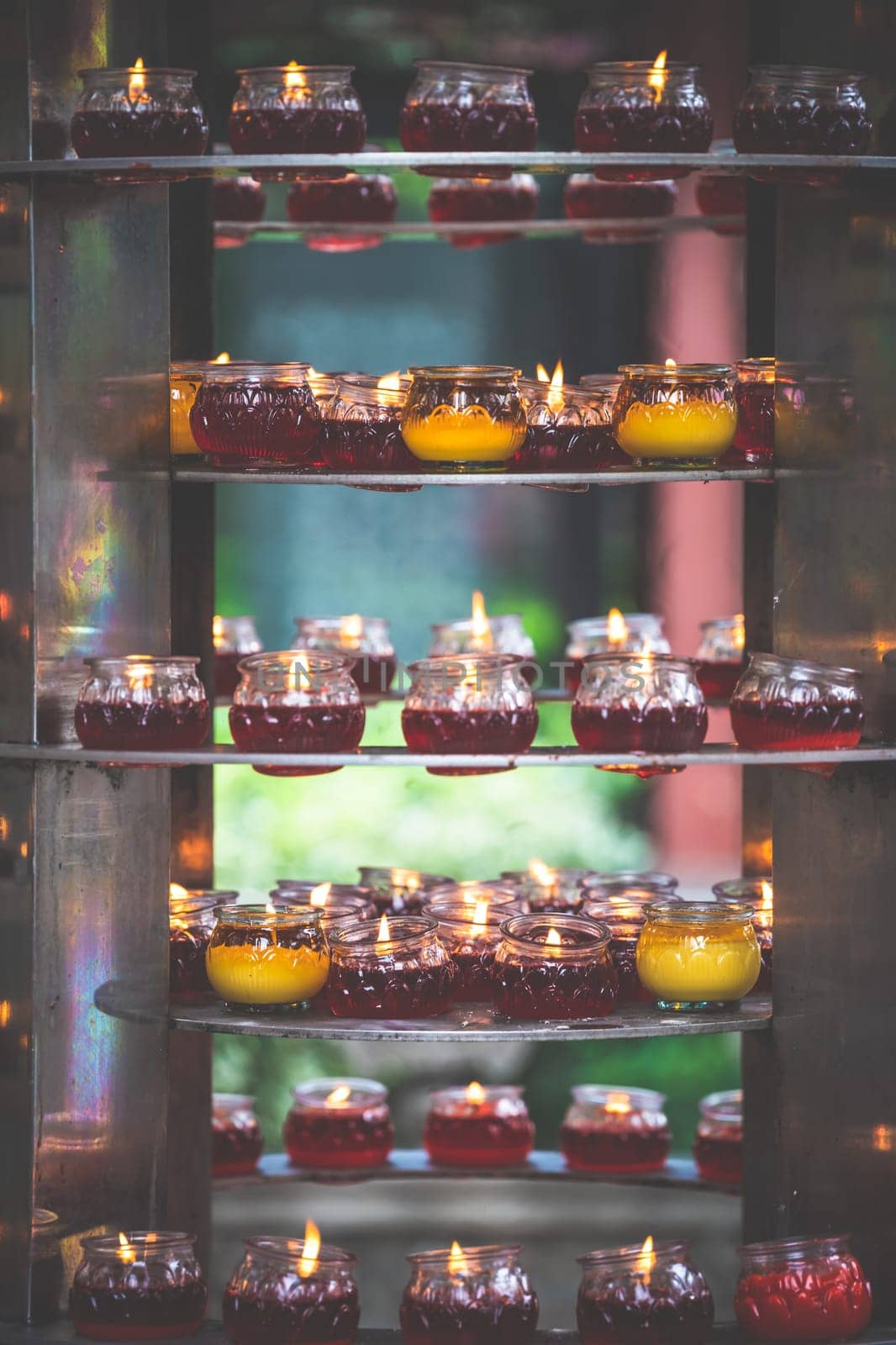 Fire burning in the memorial candles in the Wenshu Monastery, Chengdu, China