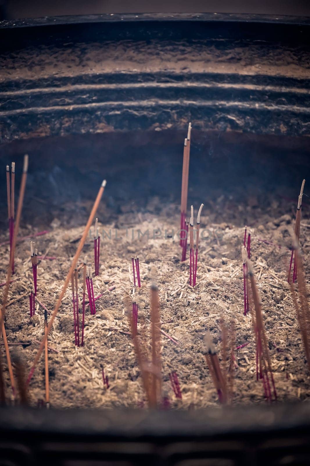 Close up of burning incense sticks in the courtyard of Wenshu Temple, Chengdu, Sichuan Province, China