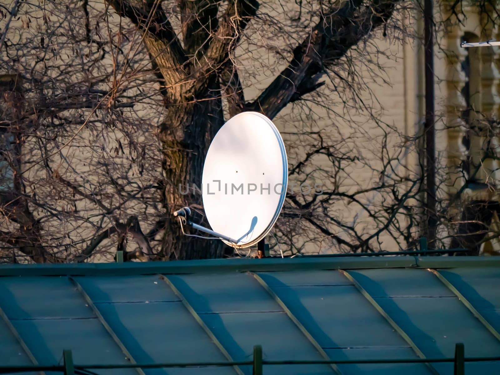 Satellite dish on the roof of the house. Technology. Place for text. Background image.