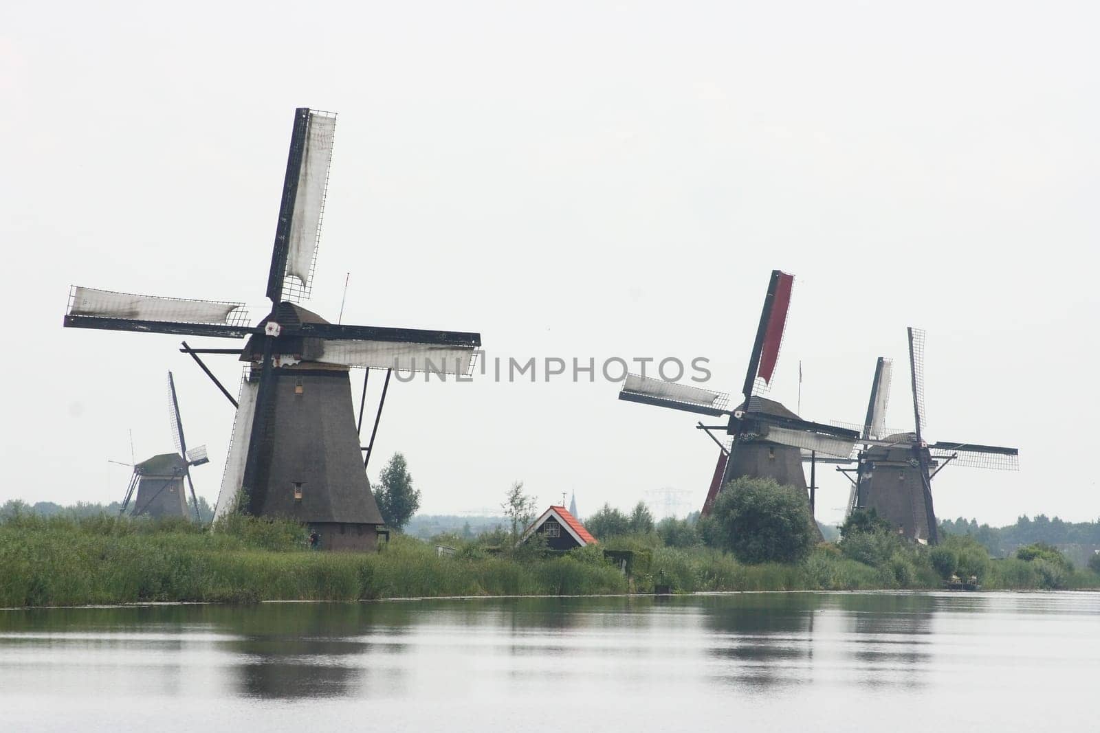 A beautiful, old, historic windmill, with four wings
