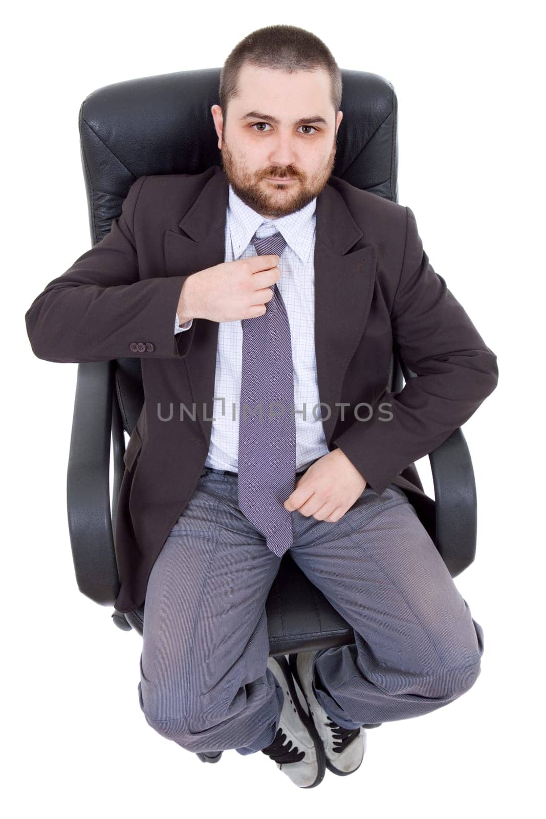 young businessman on a chair, isolated on white