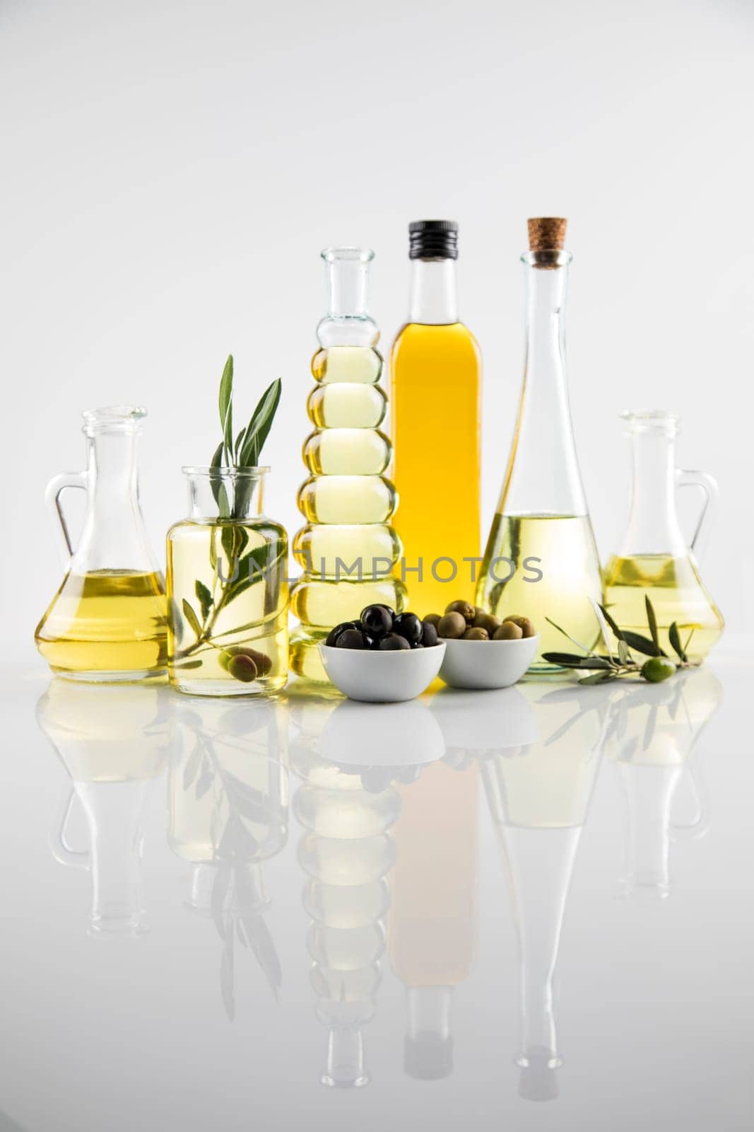 Olive oil bottles, olive branch and Cooking oils