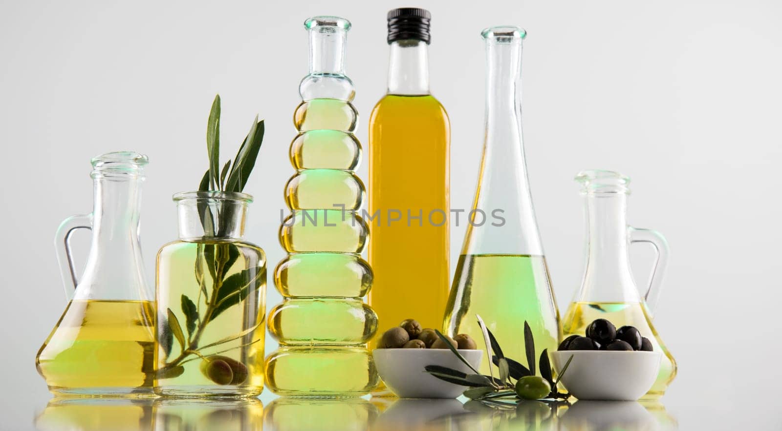 Olive oil bottles, olive branch and Cooking oils