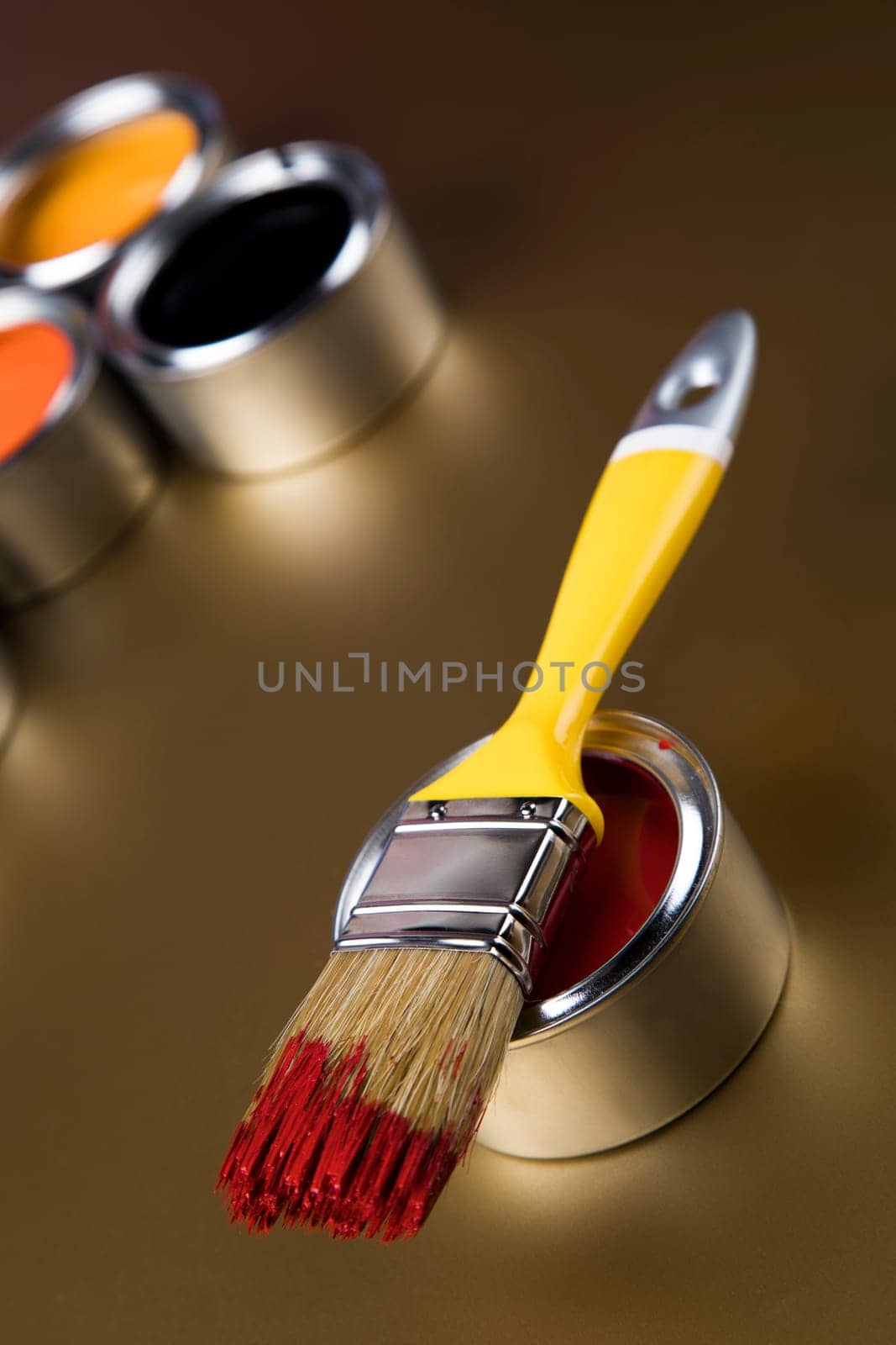 Tin metal cans with color paint and paintbrush