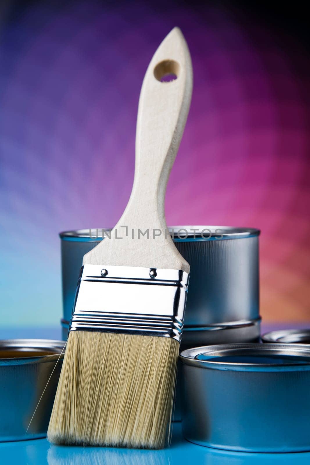 Tin metal cans with color paint and paintbrush