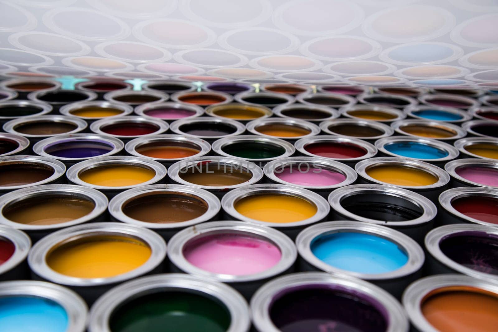 Group of tin metal cans with color paint