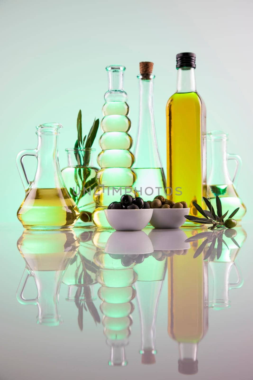 Olive oil bottles, olive branch and Cooking oils