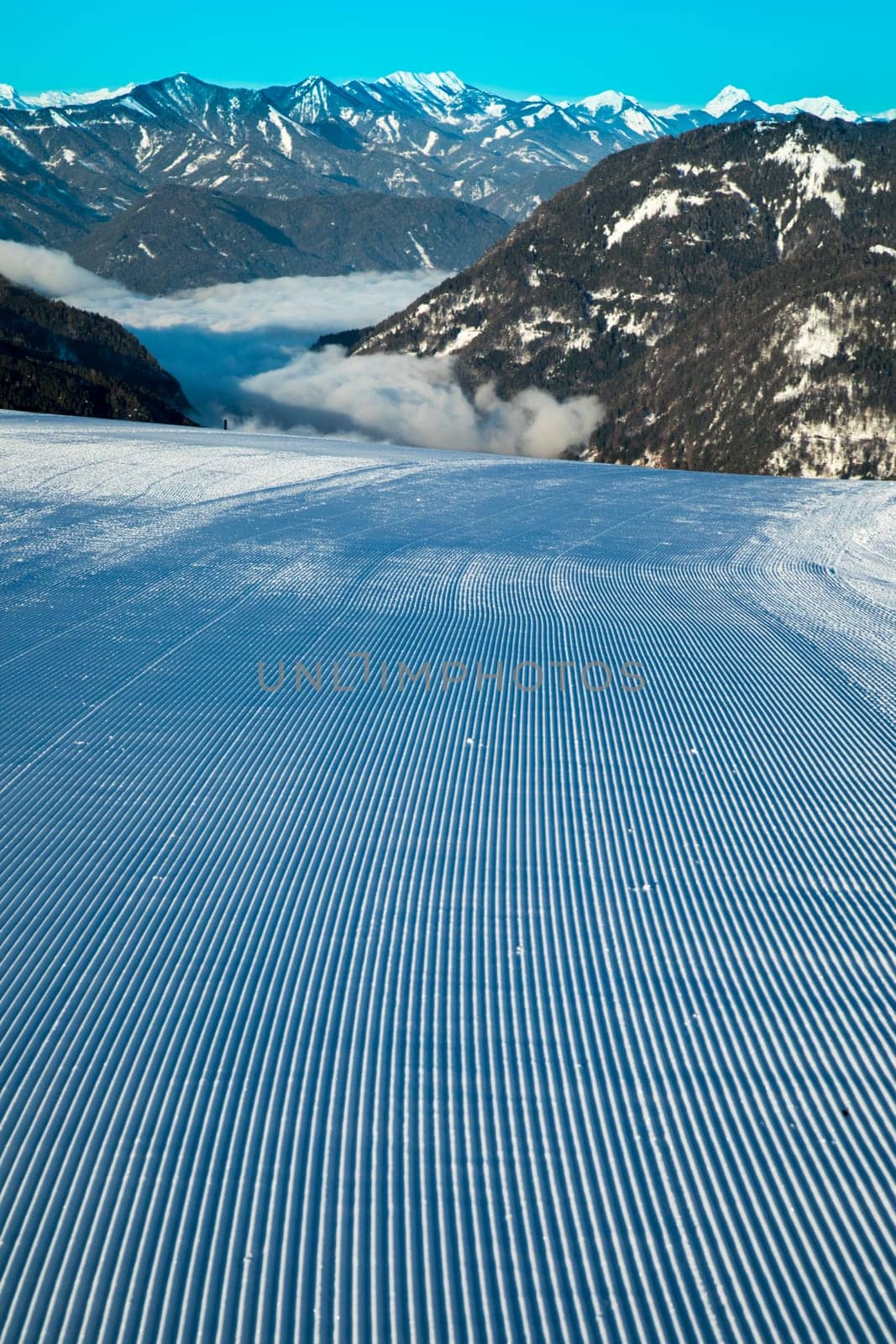 Winter mountains panorama with ski slope