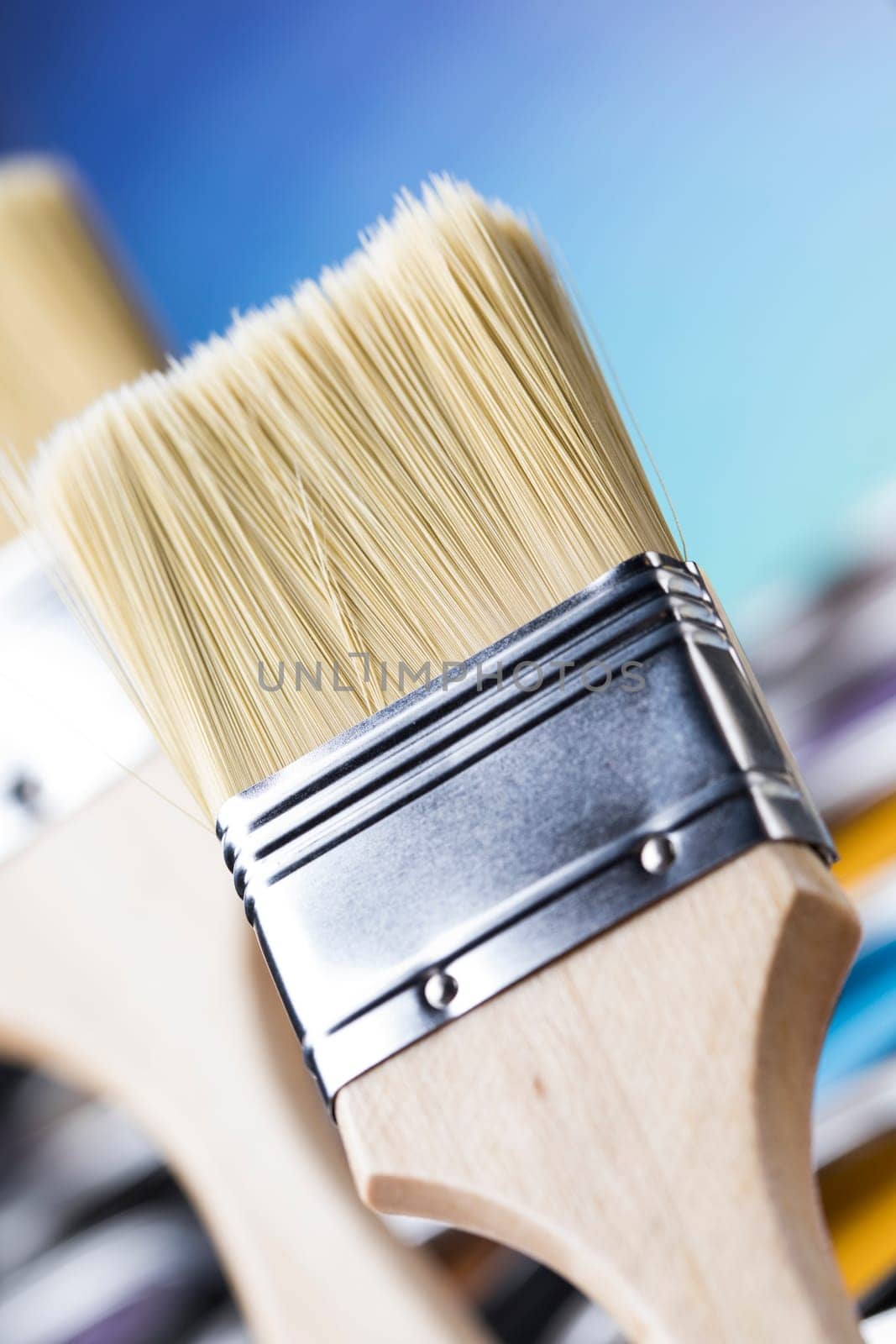 Metal tin cans with color paint and paintbrush