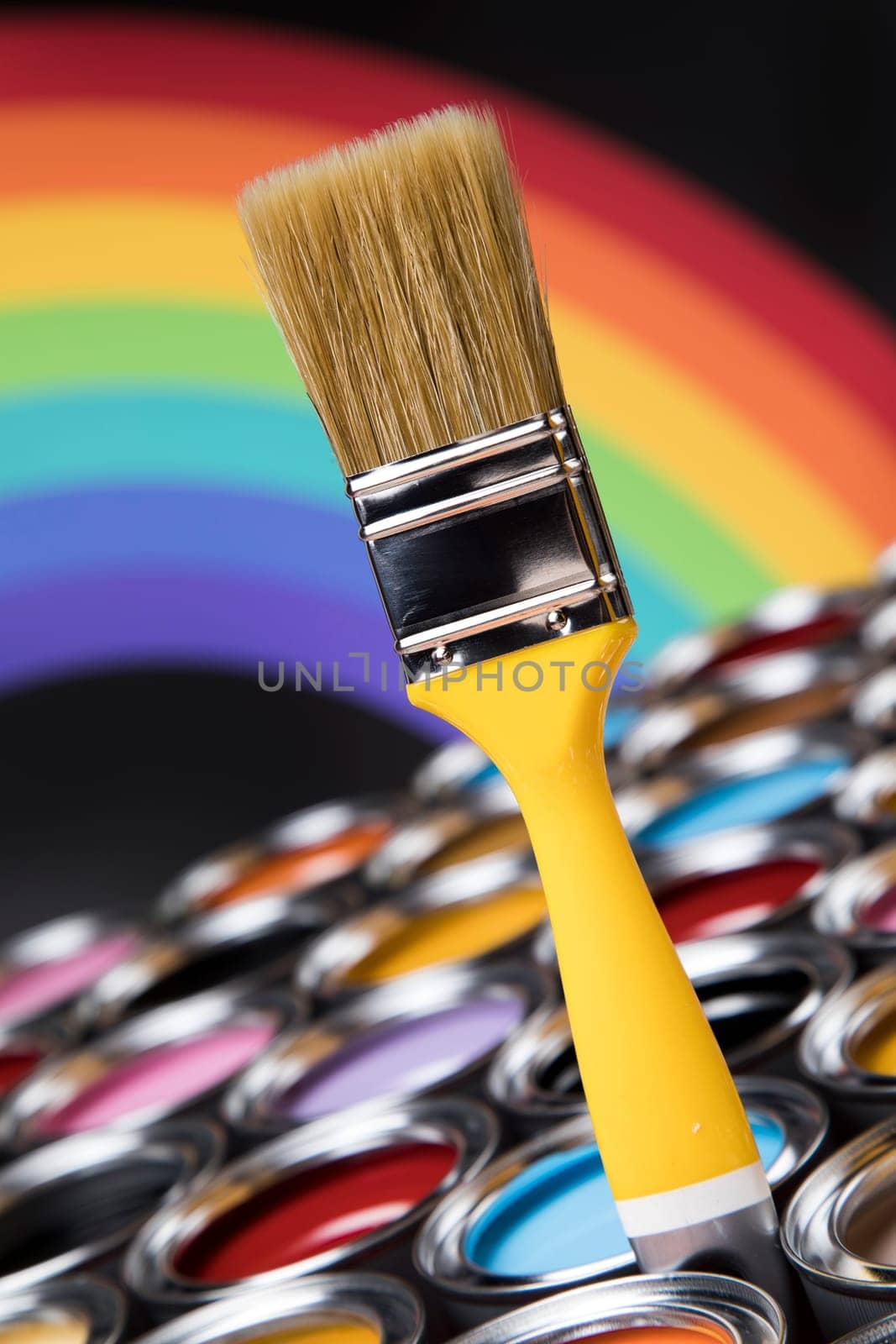 Paint can with a paintbrush