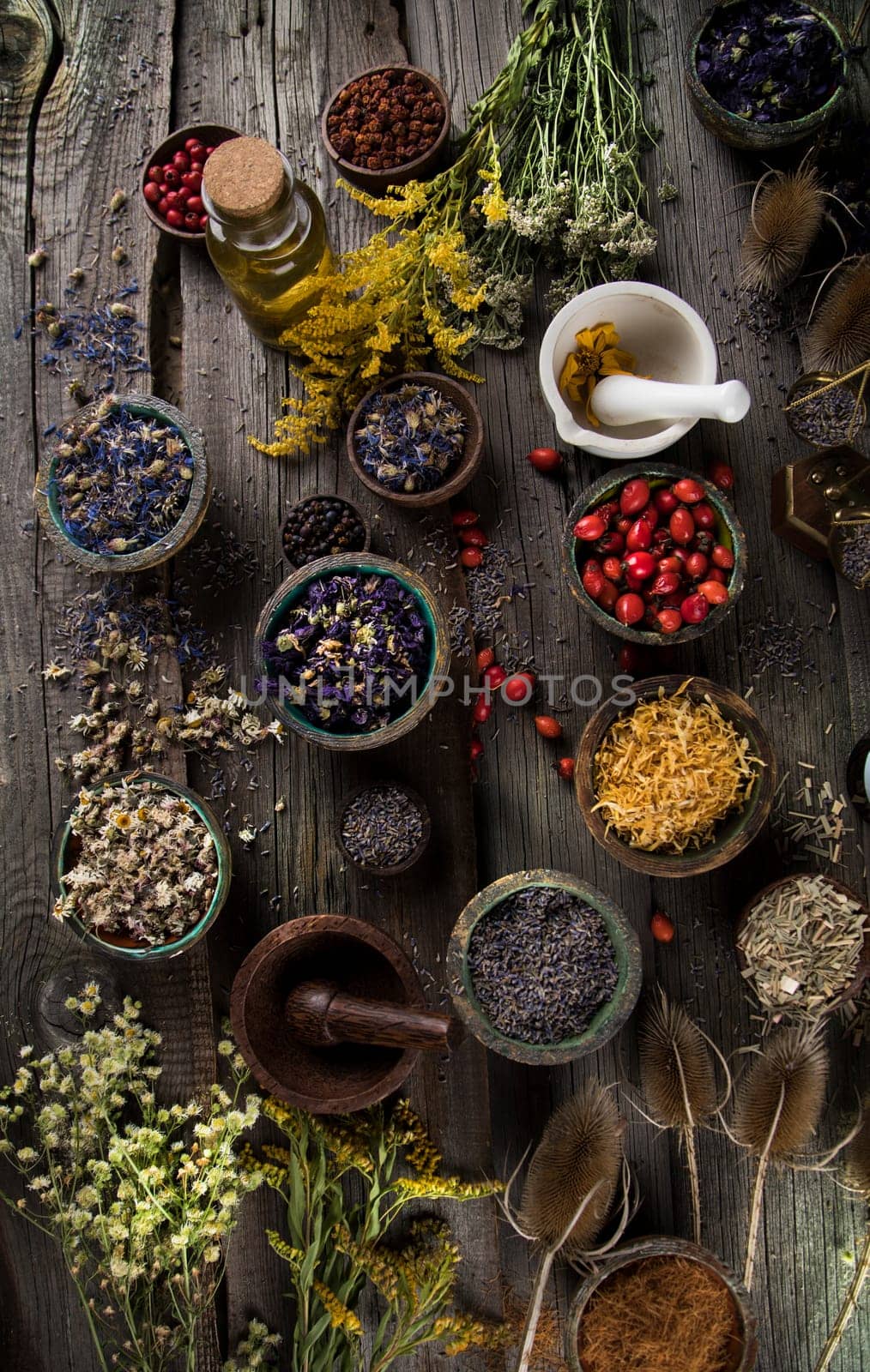 Homeopathy, herbal medicine on wooden table