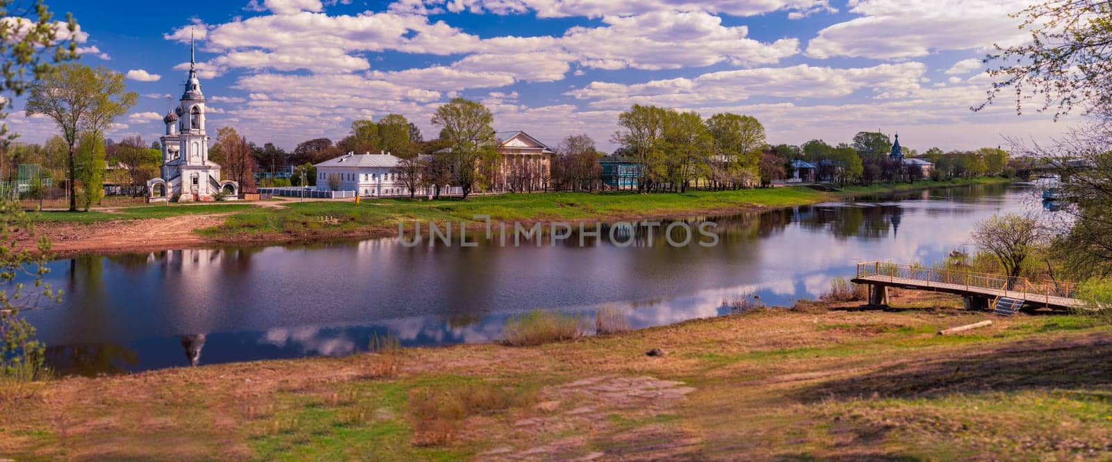 Old church in Vologda, Russia, Europe. Blue sunset sky in background and river in foreground. Travel and religion.