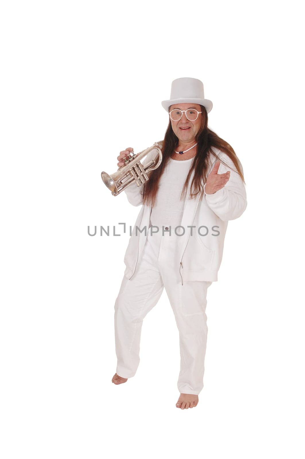 A middle age indigenous man dancing in a white outfit and white hat.playing his trumpet with his long hair, isolated for white background.