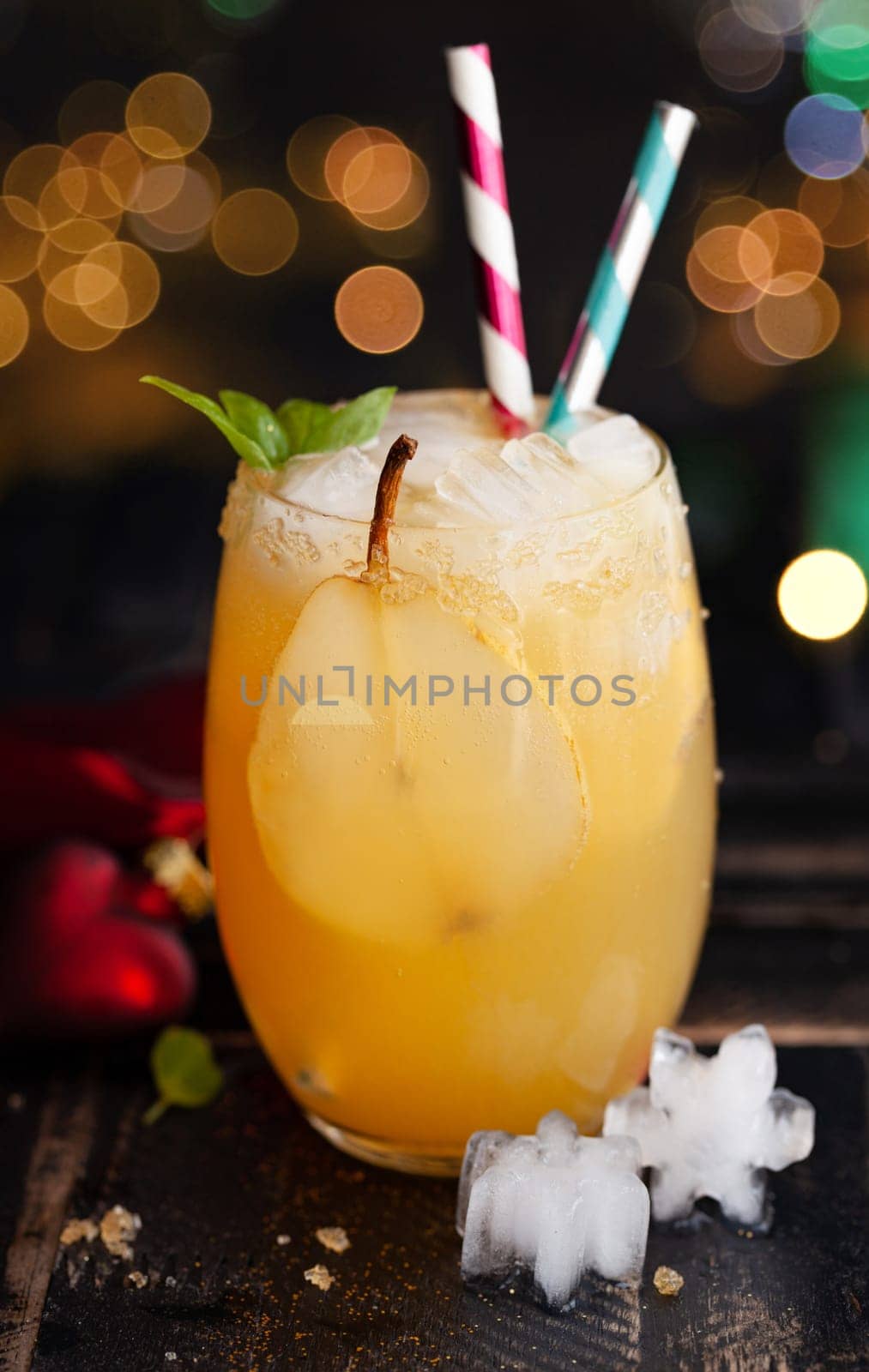 Fruity cocktail with fresh pear on ice