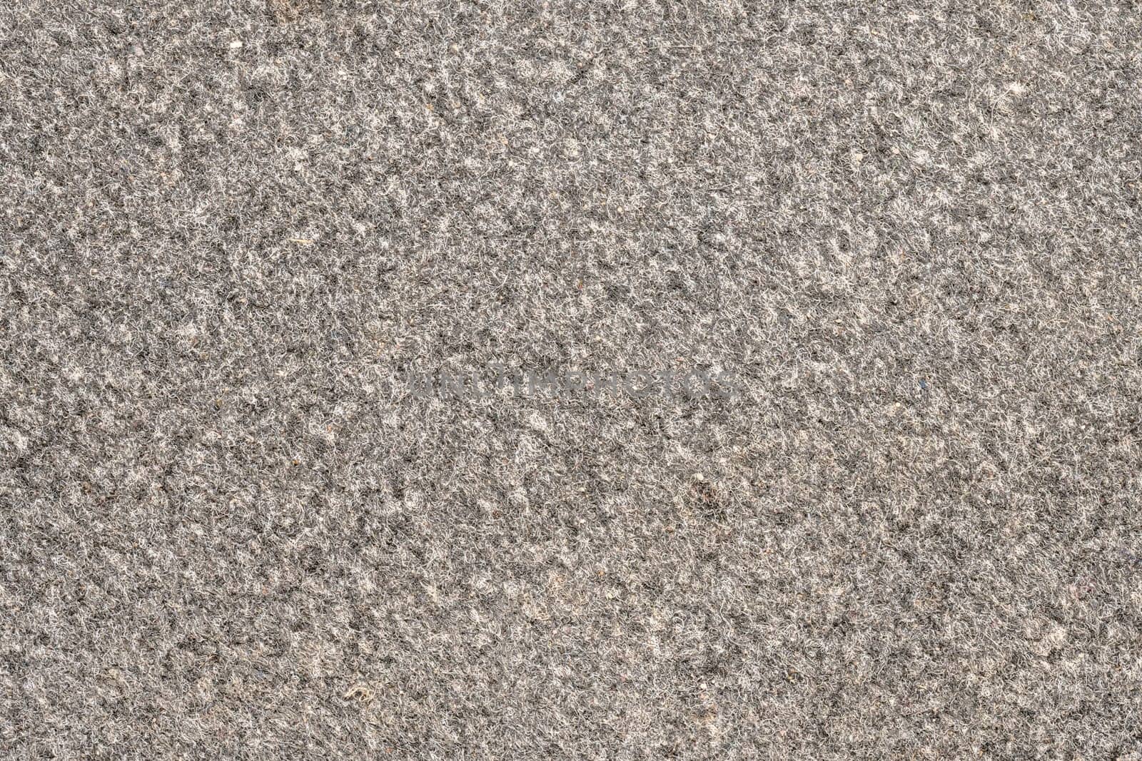 Close up of a gray white carpeting as a background
