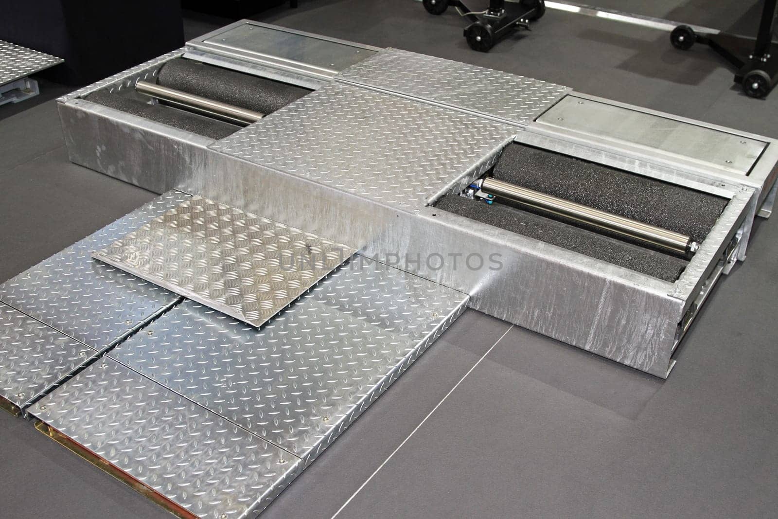 Brake test equipment with rollers in garage
