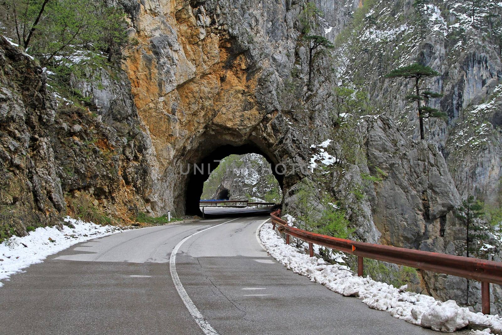 Curvy road trough tunnel in Montenegro mountains