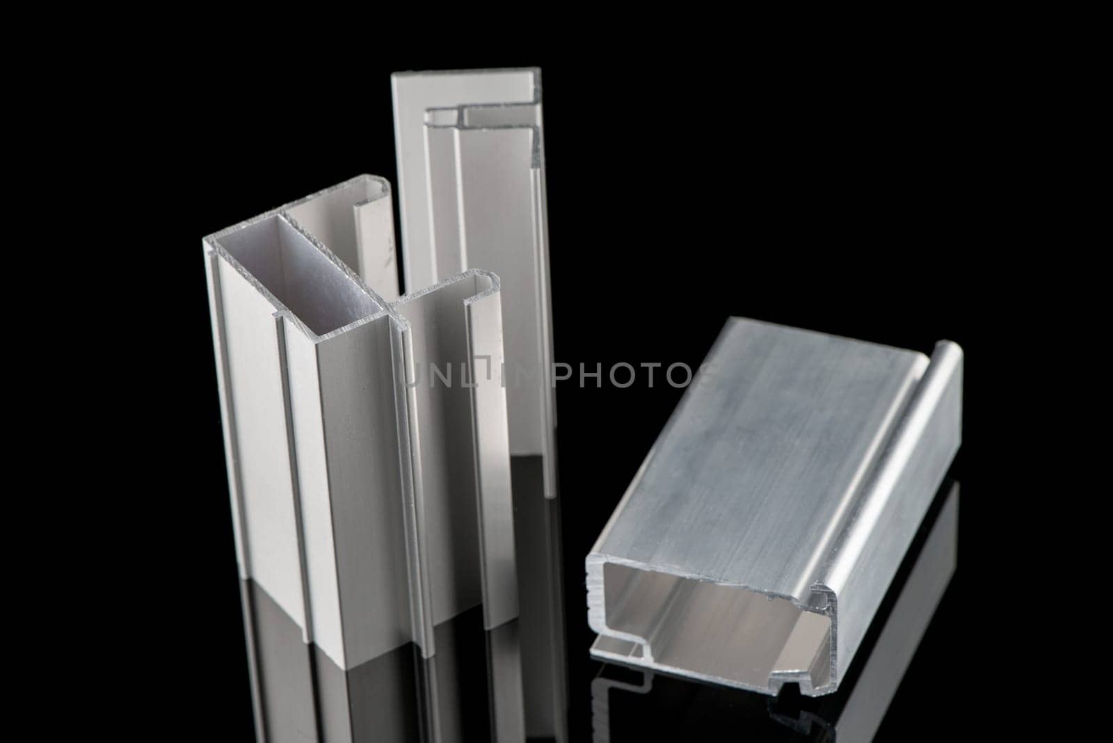 Aluminum profile sample isolated on black background.