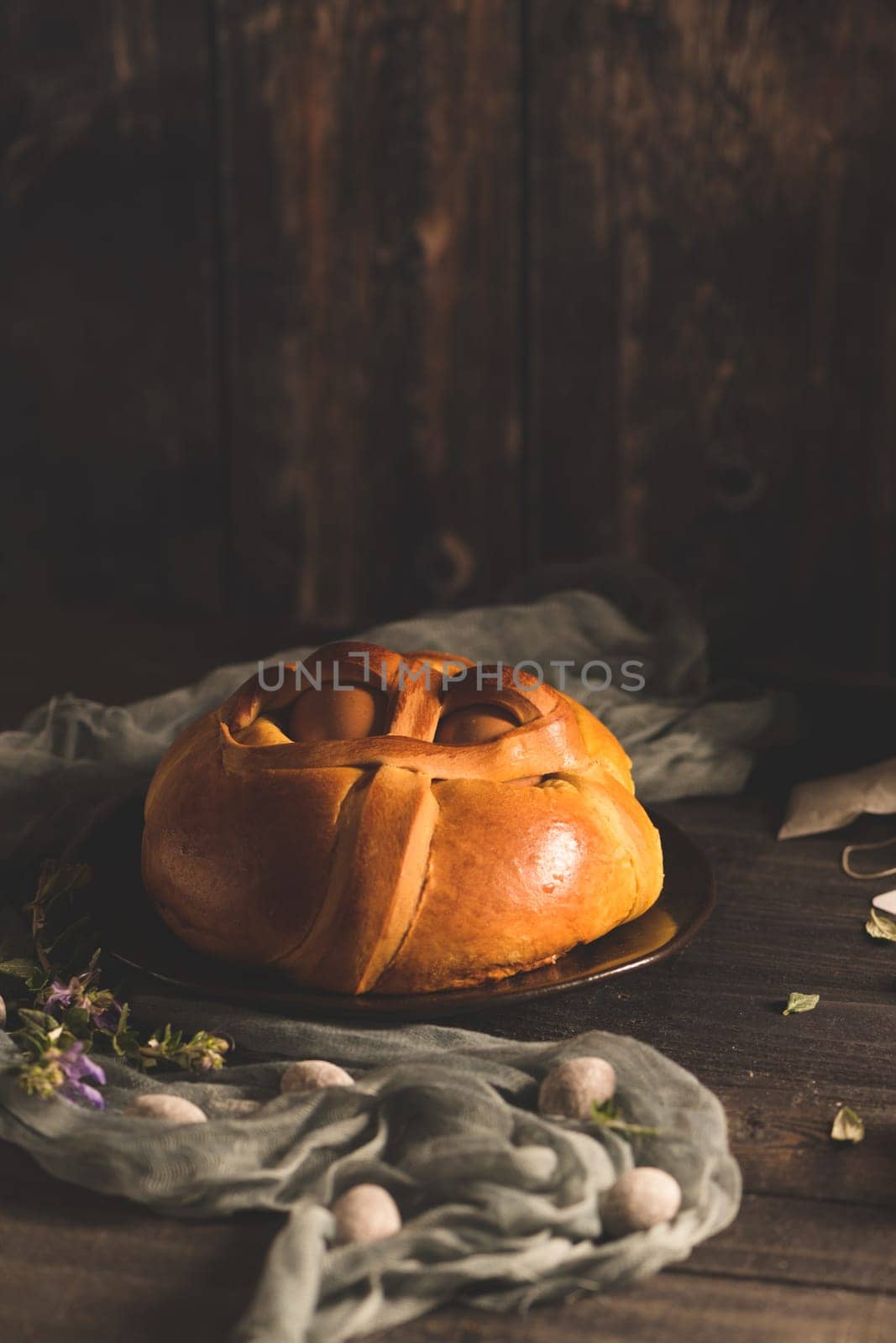 Easter folar with egg on wooden table top.