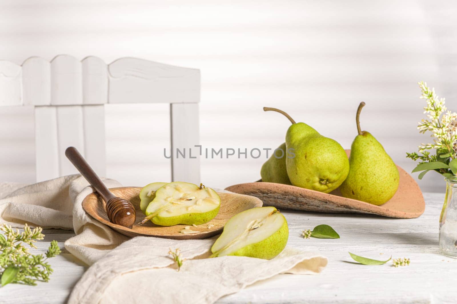 Tasty pears with honey and nuts on wooden table.