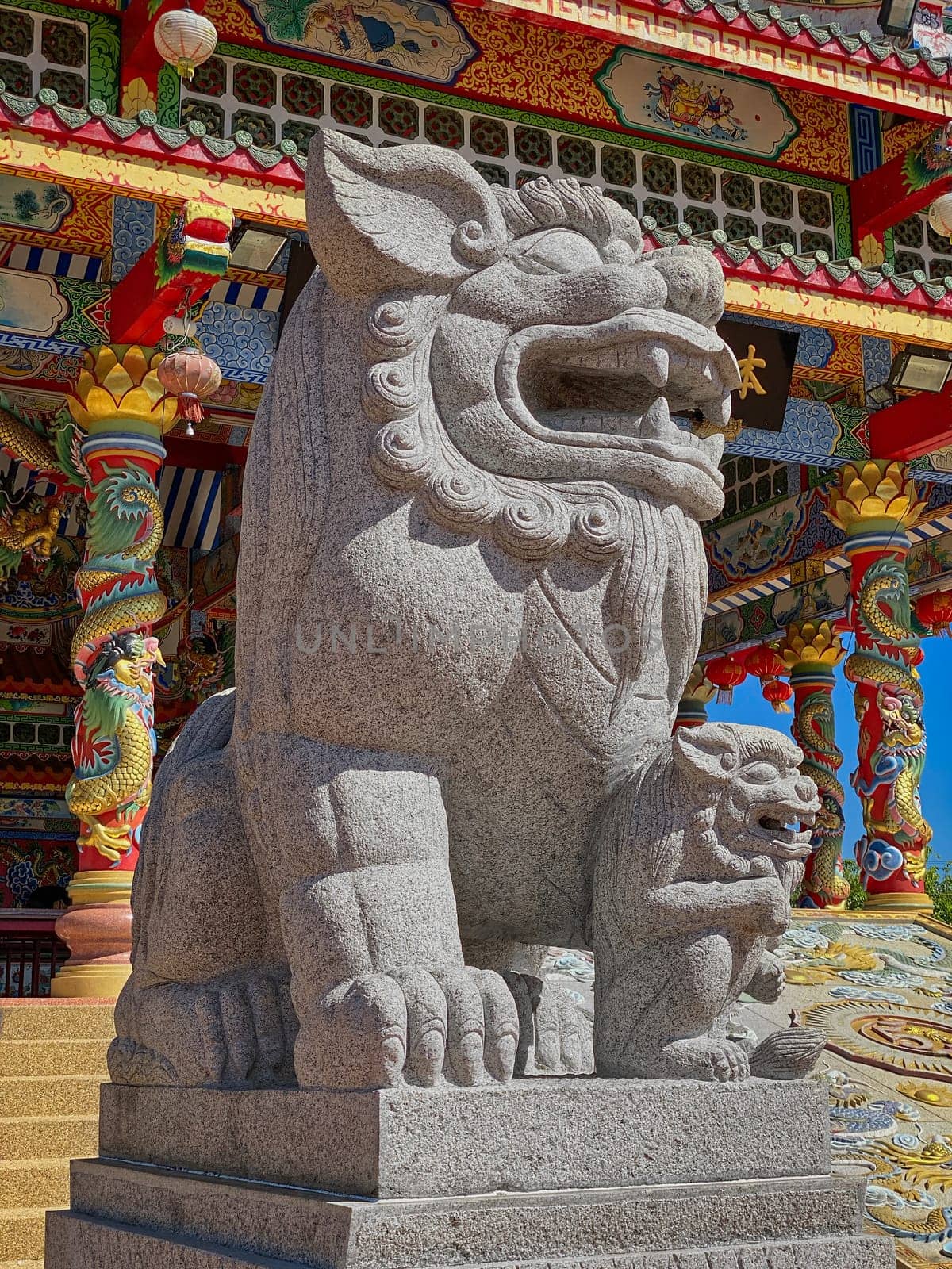 Chinese Lion Figurine, stone sculpture in front of Chinese temple