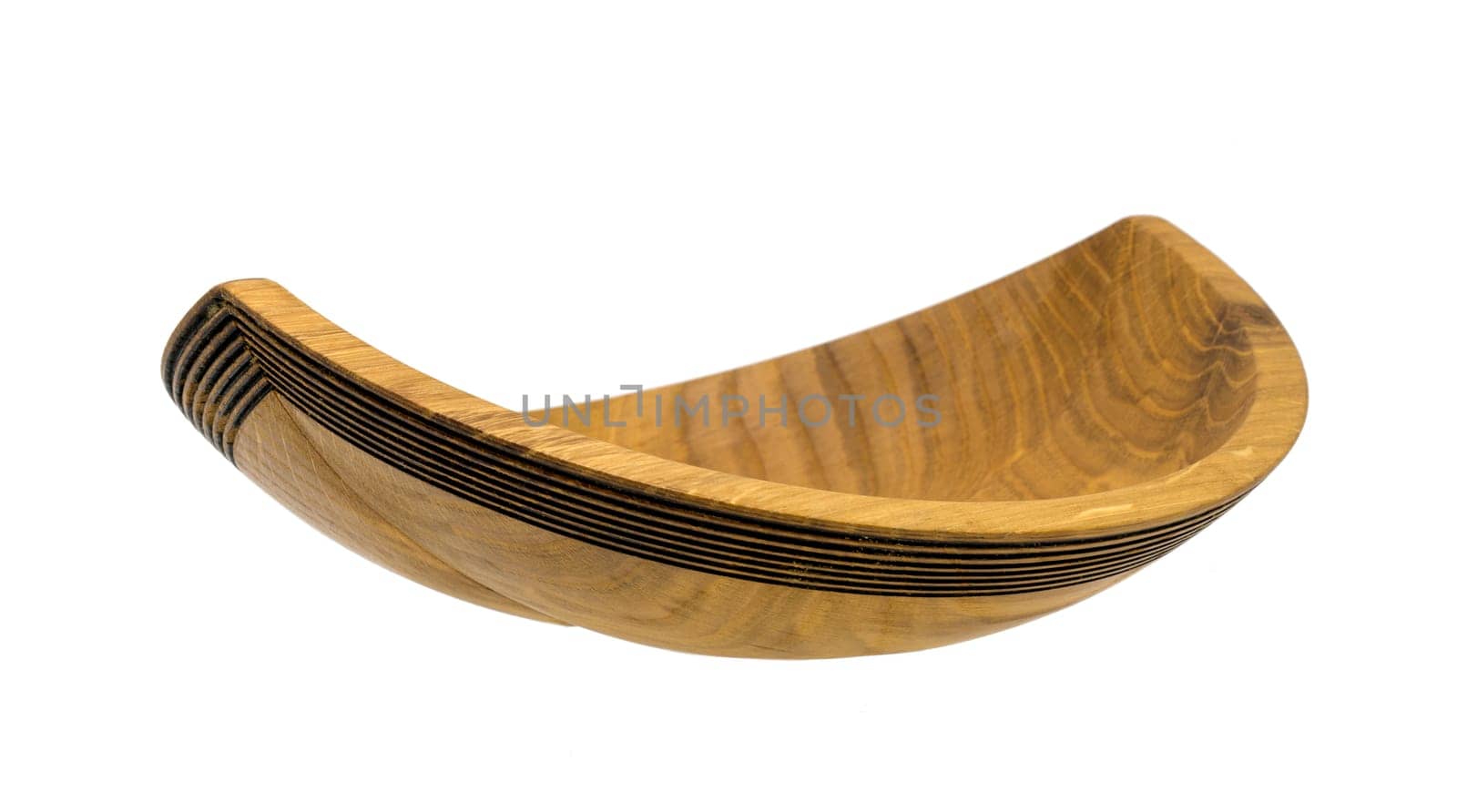 Hand-turned wooden bowl made of oak in the form of a ship isolated on white