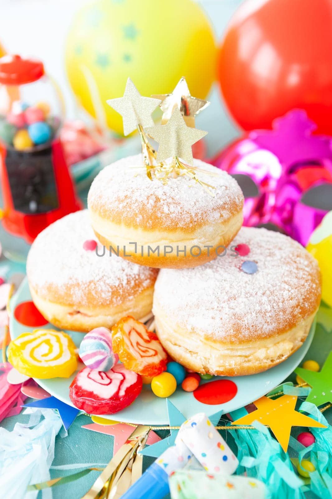 Delicious jam-filled donuts and colorful candies and sweets