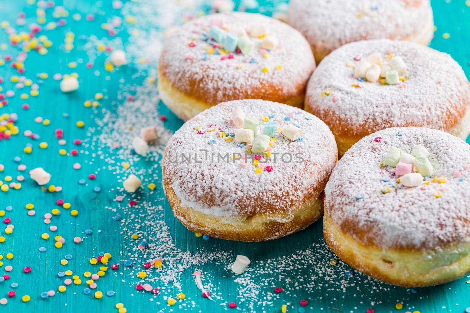 Carnival powdered sugar raised donuts - German Berliner donuts, Krapfen filled with jam