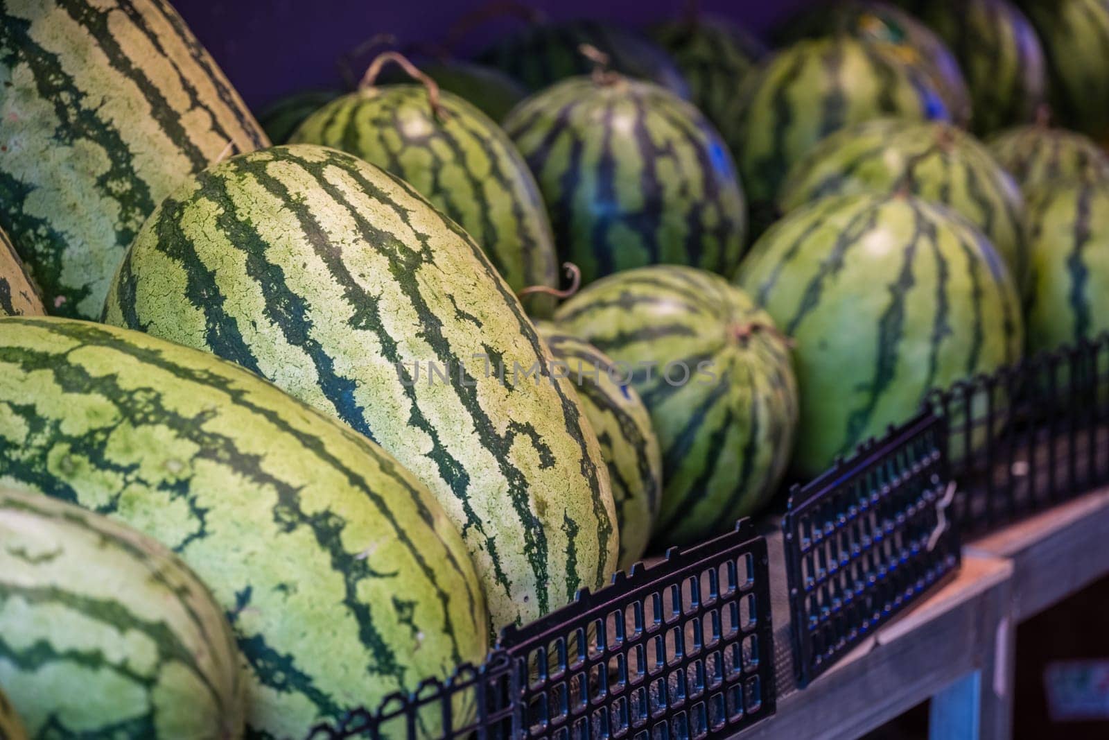 Huge watermelons for sale in a fruit and vegetable shop on the street in Zigong, China