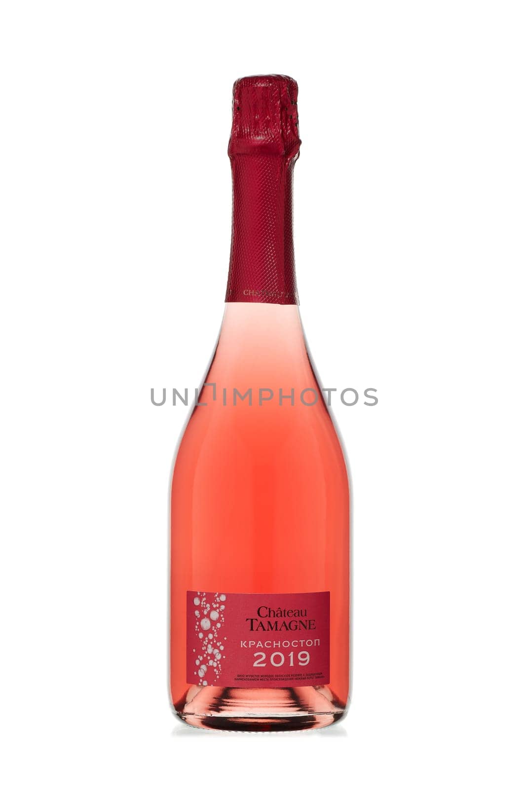 St.Petersburg, Russia - December 2019  - Bottle of semi-dry pink young sparkling wine Chateau Tamagne Krasnostop 2019  isolated on white background.