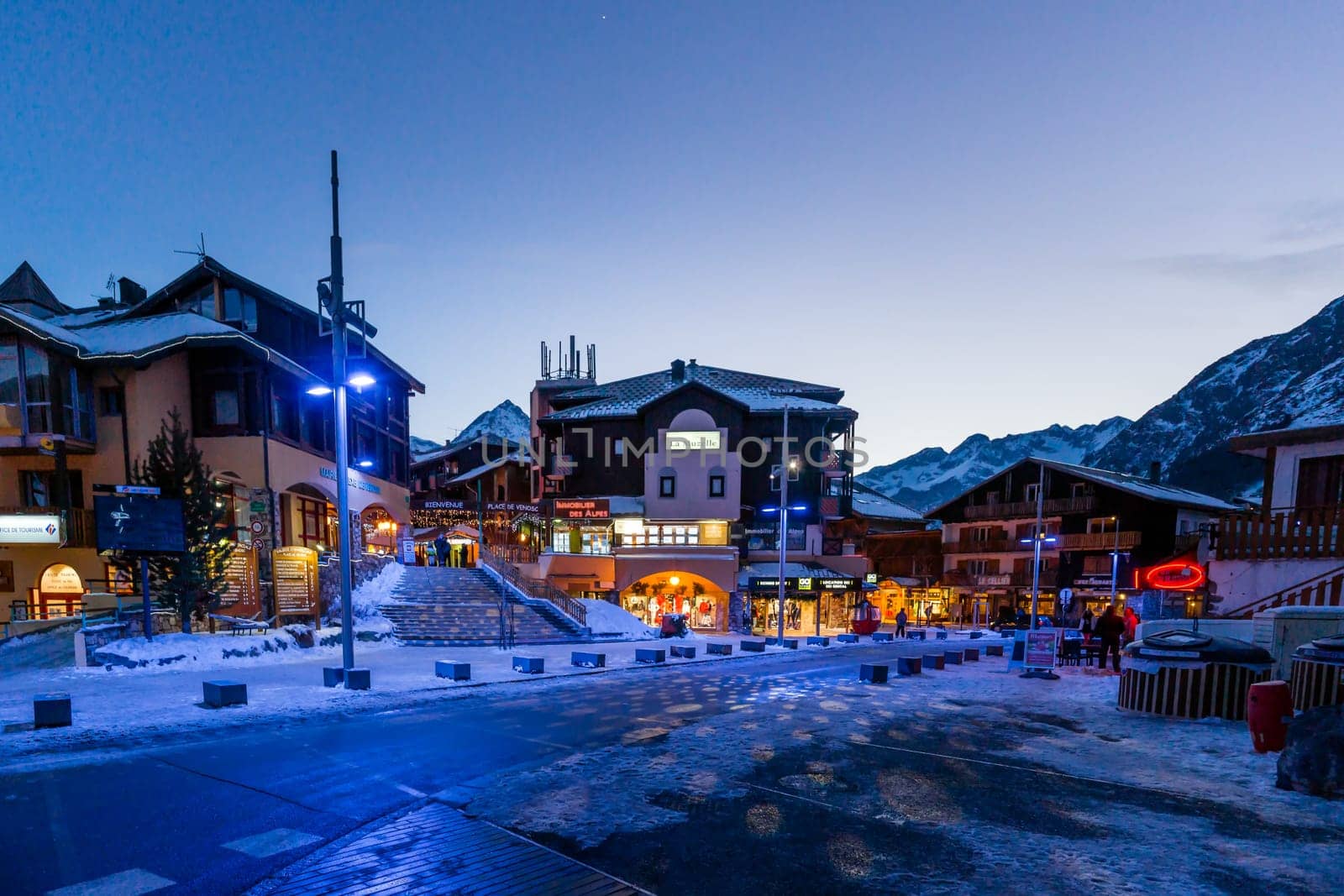 Les deux Alpes, Alps, France, January 2017 Nightlife in alpine village with traditional wooden houses, shops and restaurants. Popular ski destination