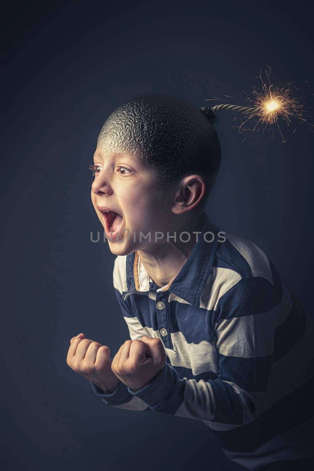 angry caucasian child with bomb shaped head about to explode. Concept of anger and uncontrolled emotions. Vertical format.