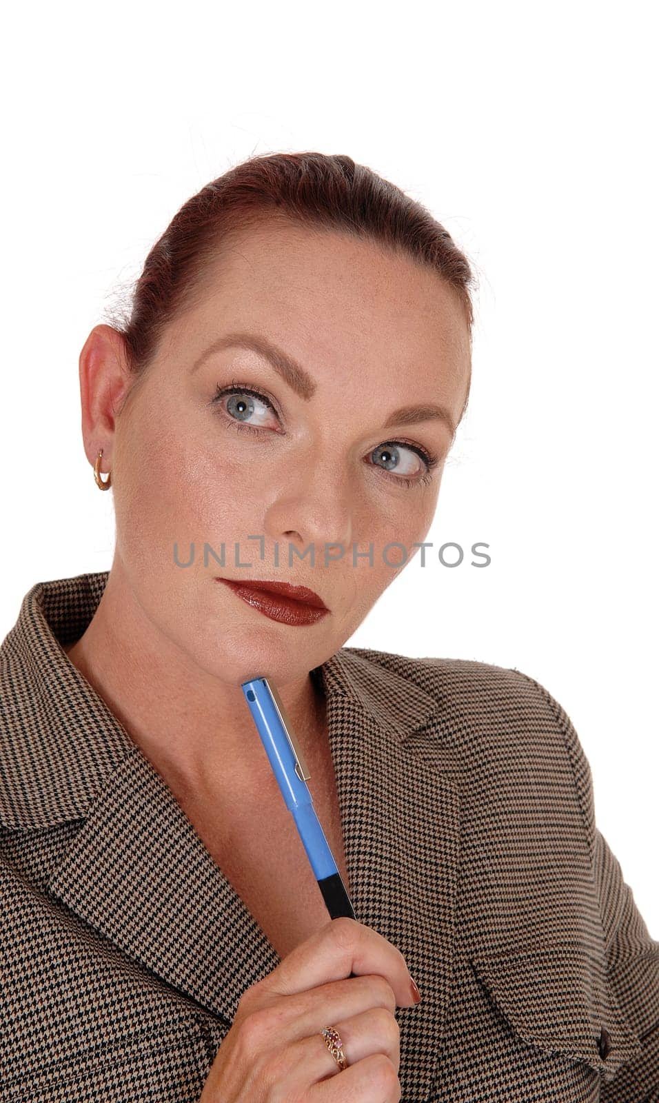 A serious looking business woman holding her blue pen.looking away and thinking hard, isolated for white background.