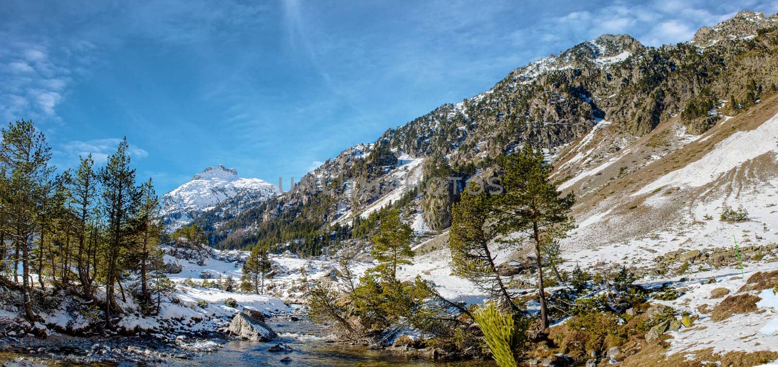 small river in the snowy Pyrenees mountains, near Pont Espagne