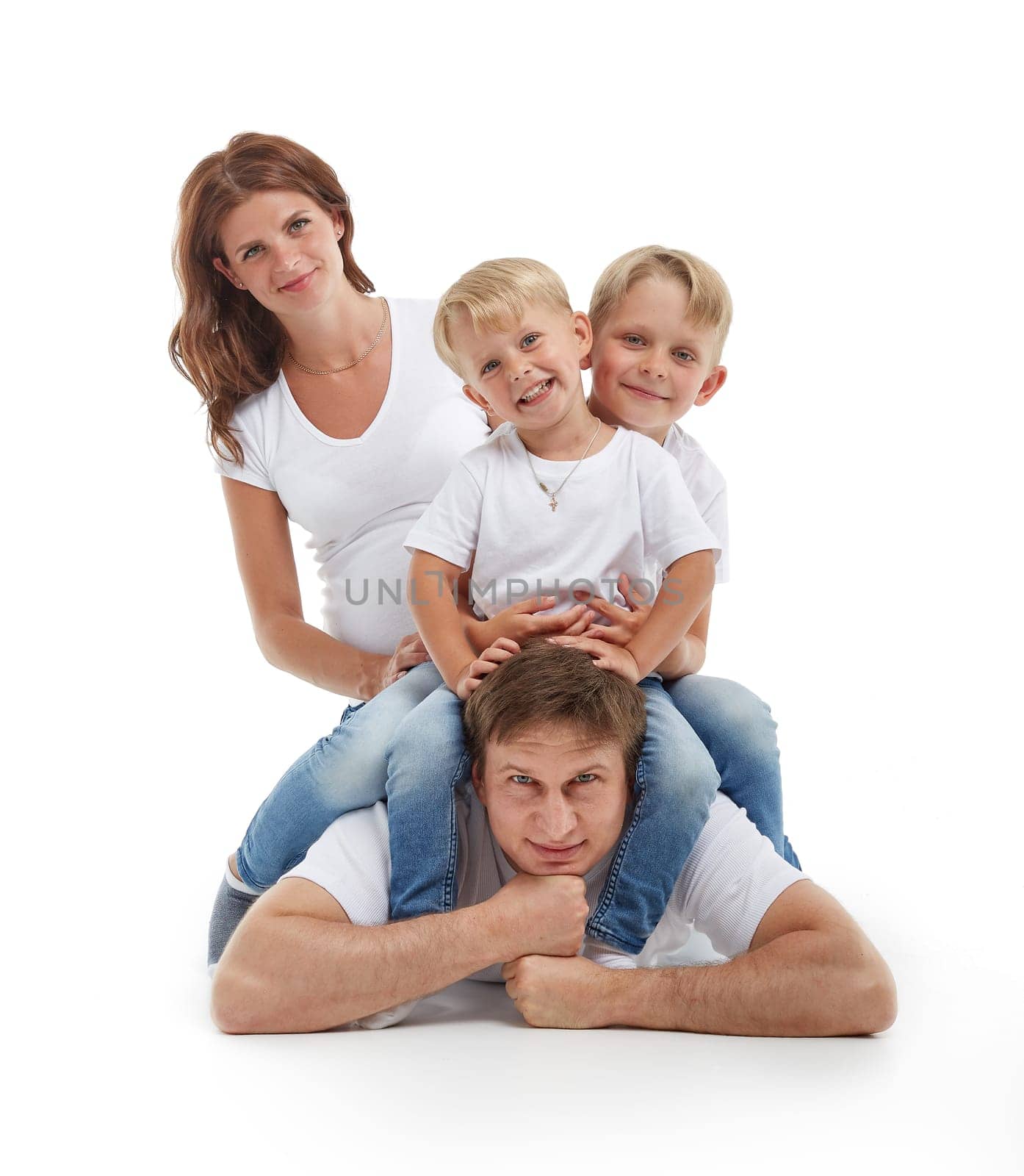 Friendly family. Young pregnant woman with two children and her husband are sitting, isolated on a white background.  Happy parents. Pregnant mother and father with two sons. Concept of people and family