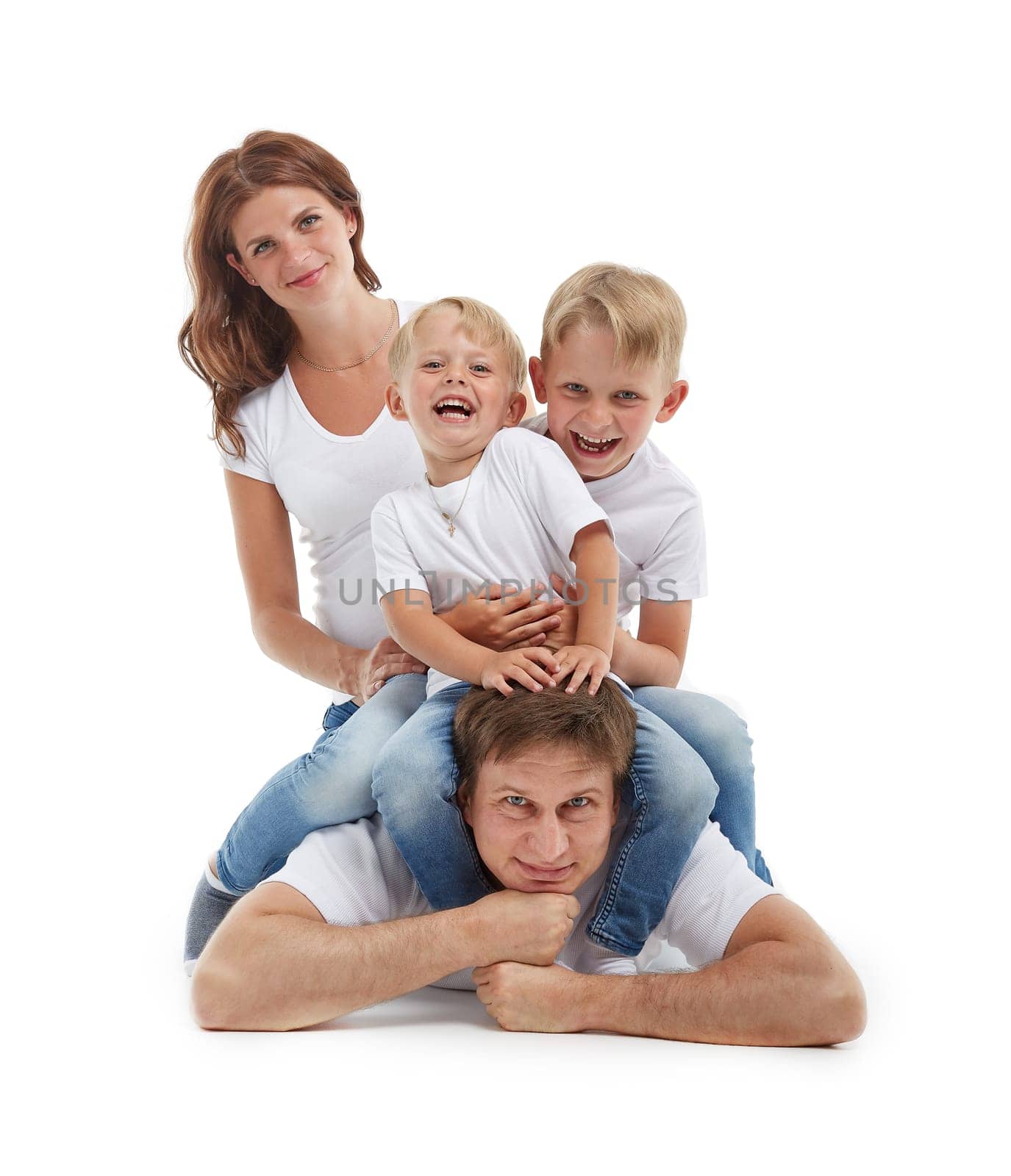 Friendly family. Young pregnant woman with two children and her husband are sitting, isolated on a white background.  Happy parents. Pregnant mother and father with two sons. Concept of people and family