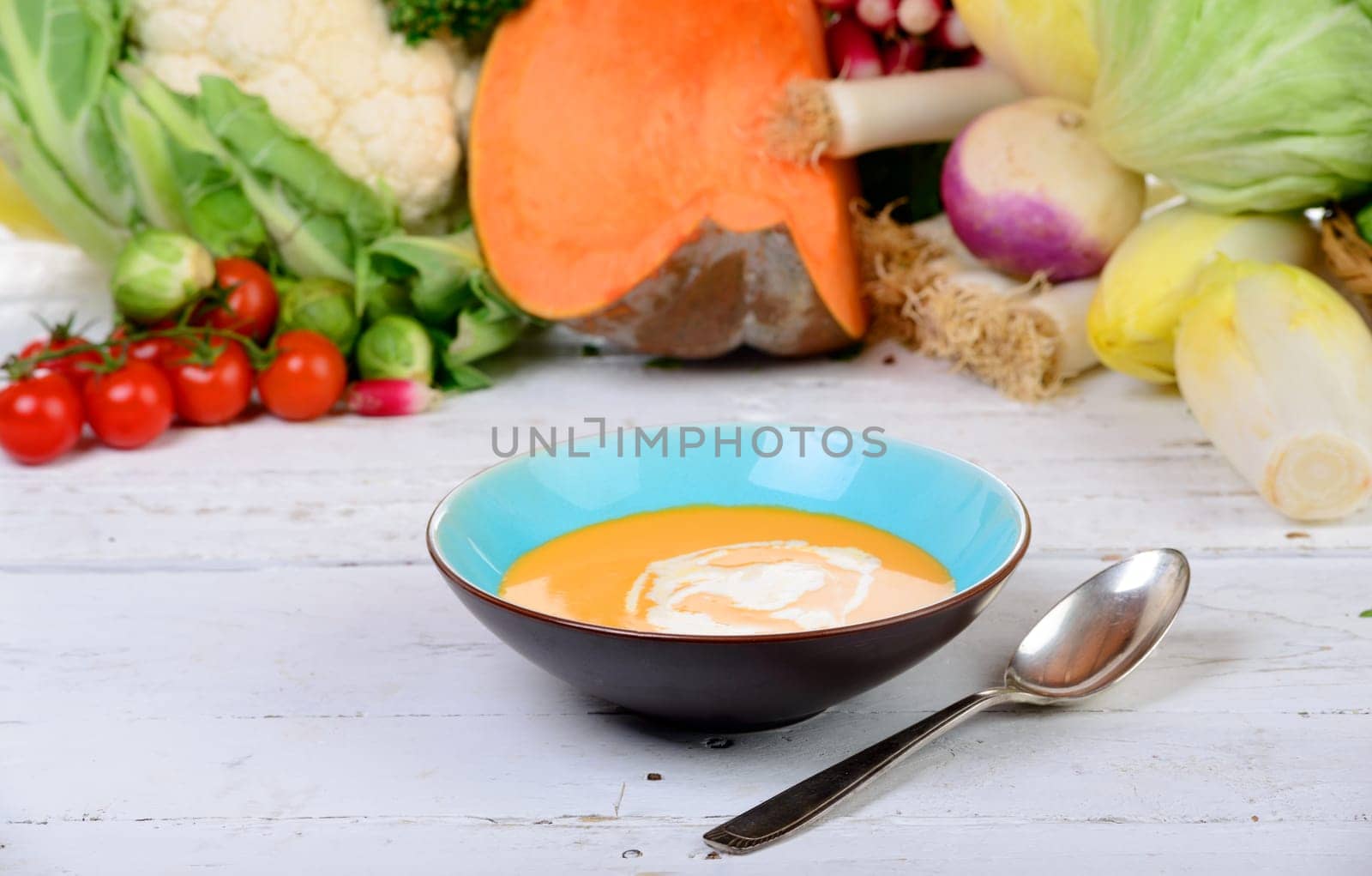 a plate of soup with several vegetables