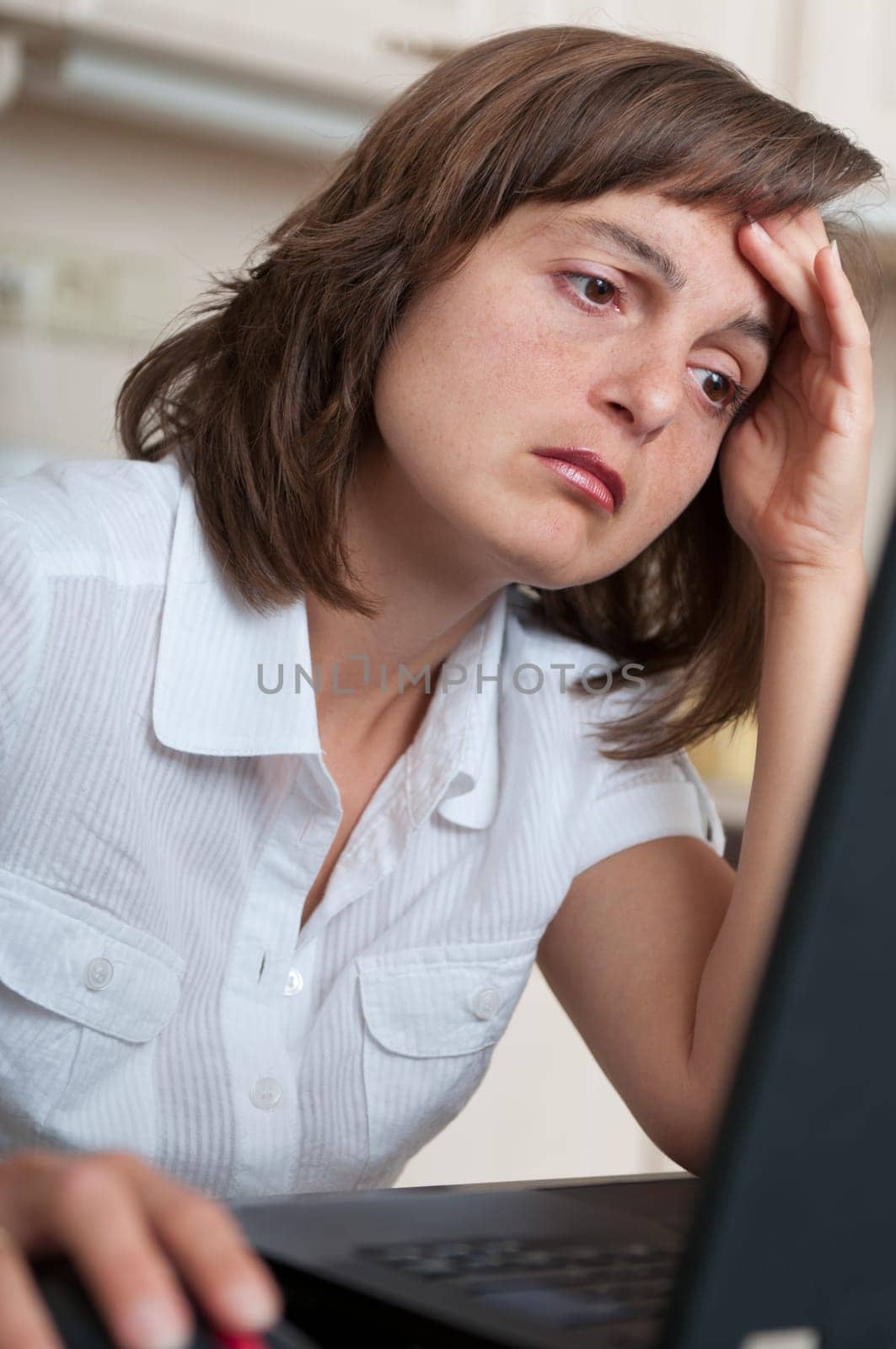 Depressed and tired business person at work