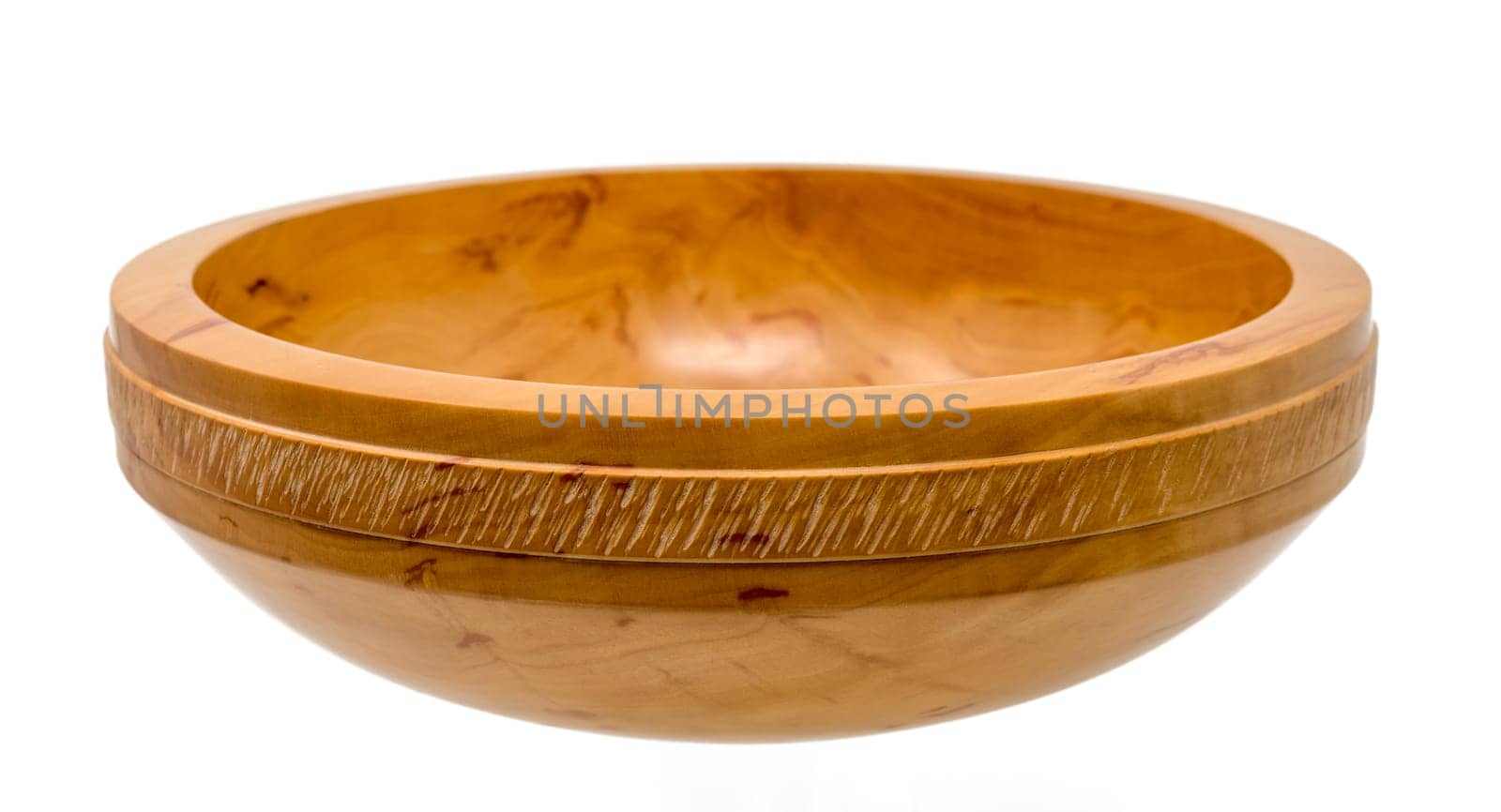 Hand-turned wooden bowl made of light pearwood with all-round decoration isolated on white