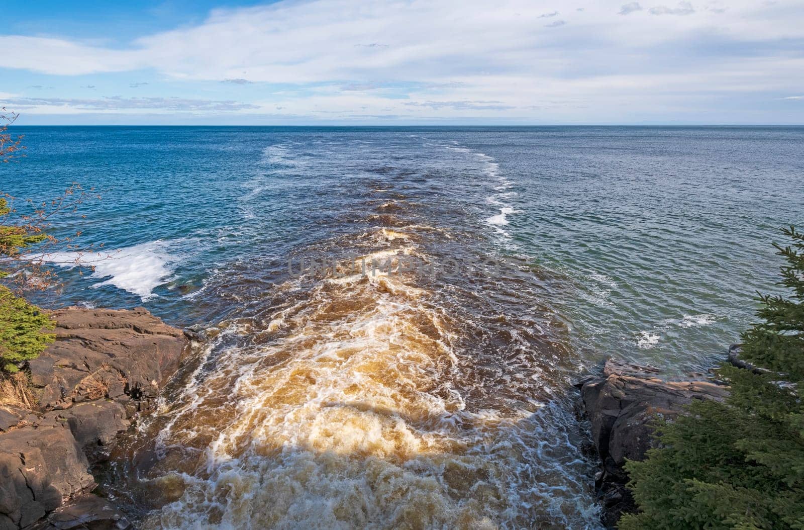 Dark Waters emptying into a Blue Lake with the Cascade River and Lake Superior