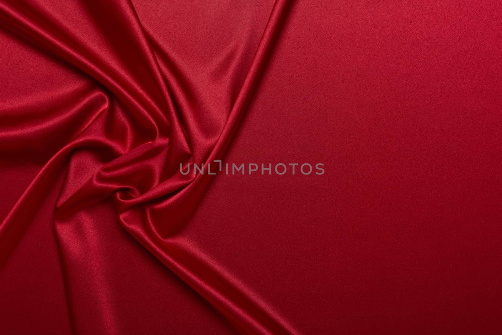 Abstract background from red silk or satin. Luxury fabric texture with draped. Top view with copy space. Element design. Valentine's day.